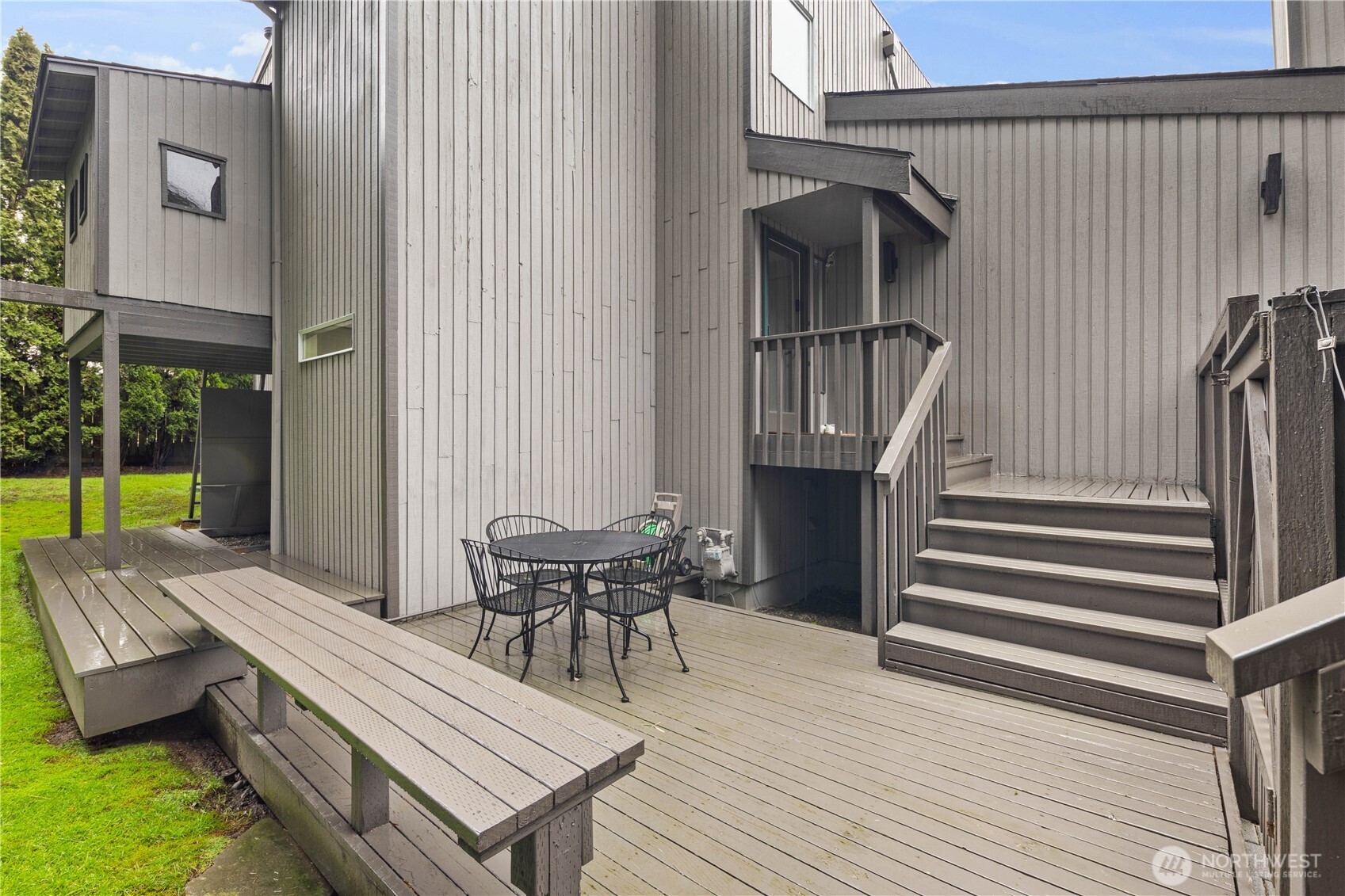 Spacious outdoor patio , perfect for entertaining, grilling, and enjoying private outdoor living surrounded by greenery. Don't miss the private clubhouse for kids above the covered grilling space.