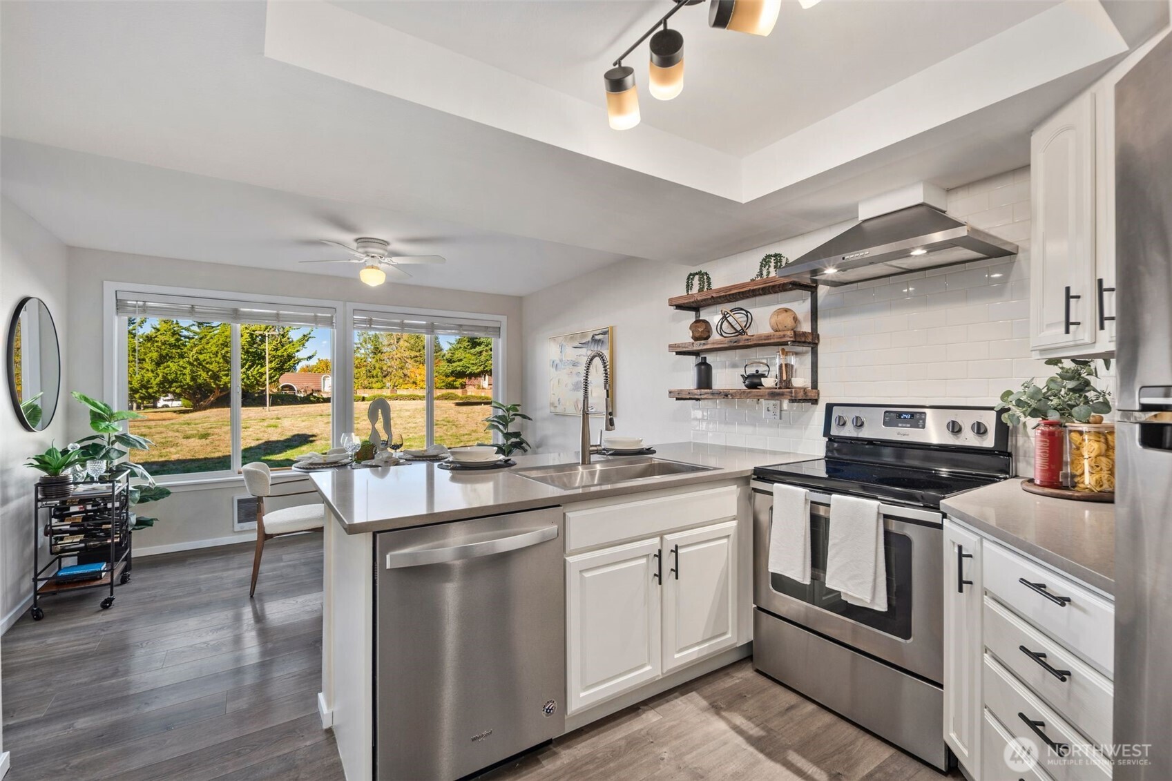 Updated kitchen with new appliances and big bright windows.
