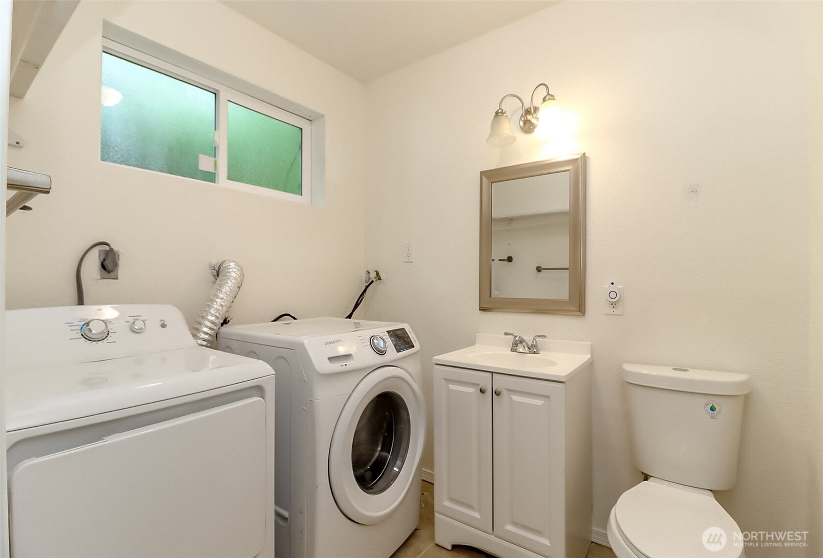 1/2 bath and laundry room on lower floor