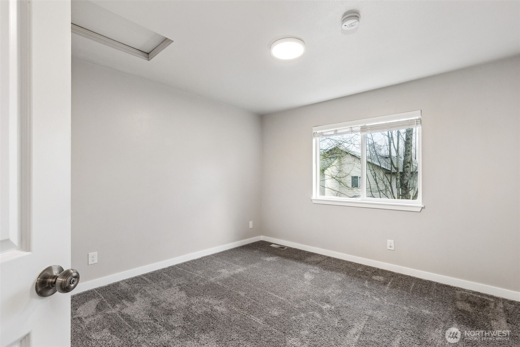 The upstairs primary bedroom has carpet to keep your feet warm and blackout blinds so you can sleep in on the weekend.