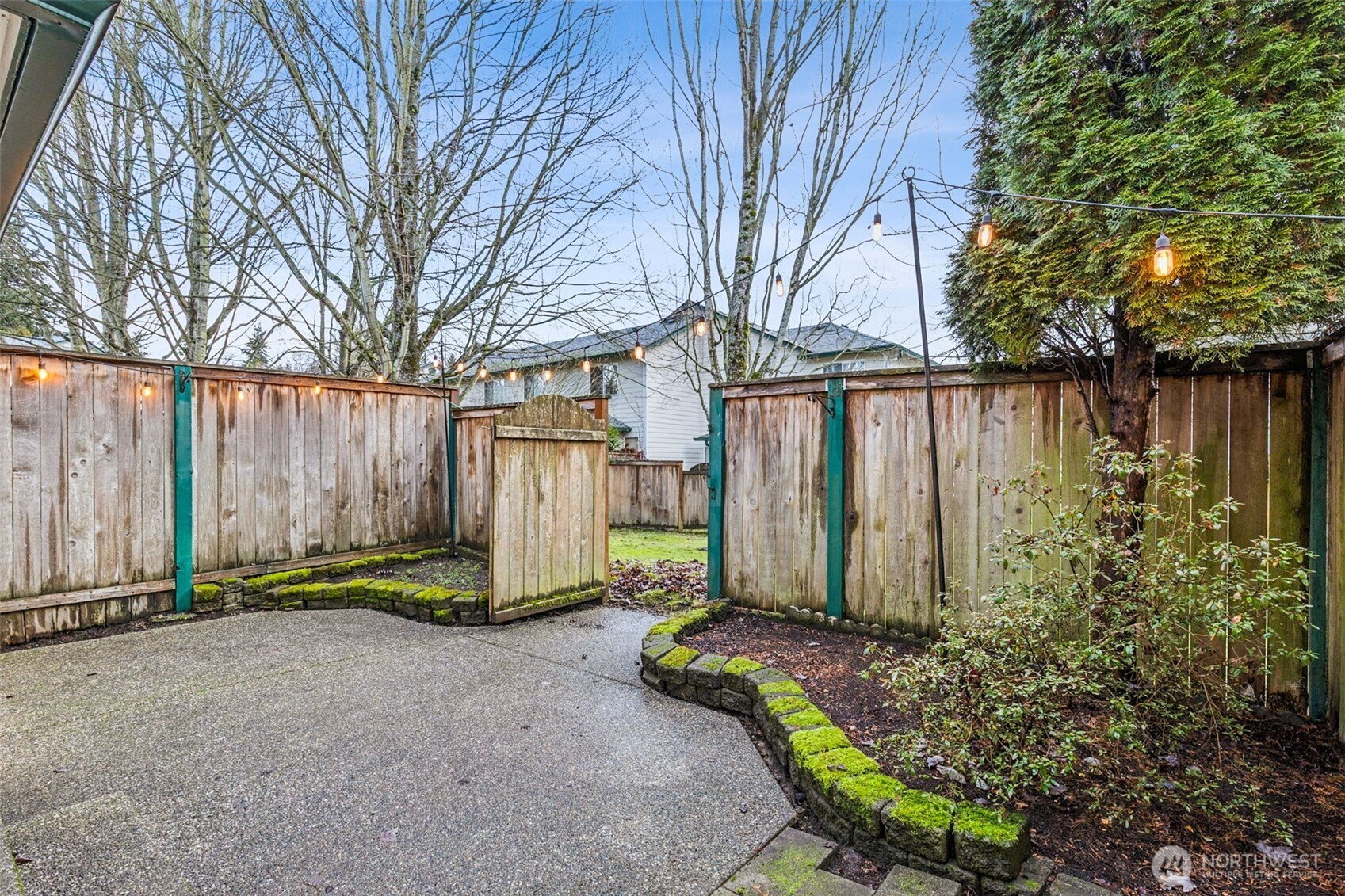 Enjoy your own private backyard patio with its gate that leads to a greenbelt.