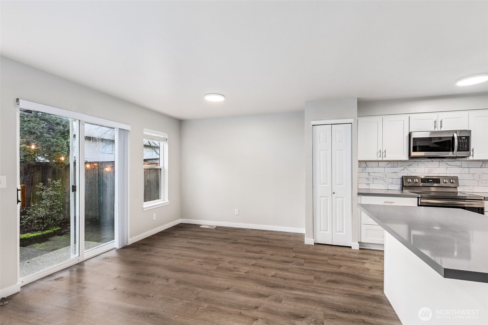 The main living room has a nice, warm fireplace for a warm, cozy winter night and the Luxury Vinyl Plank flooring goes throughout the downstairs and even down the upstairs hallway.