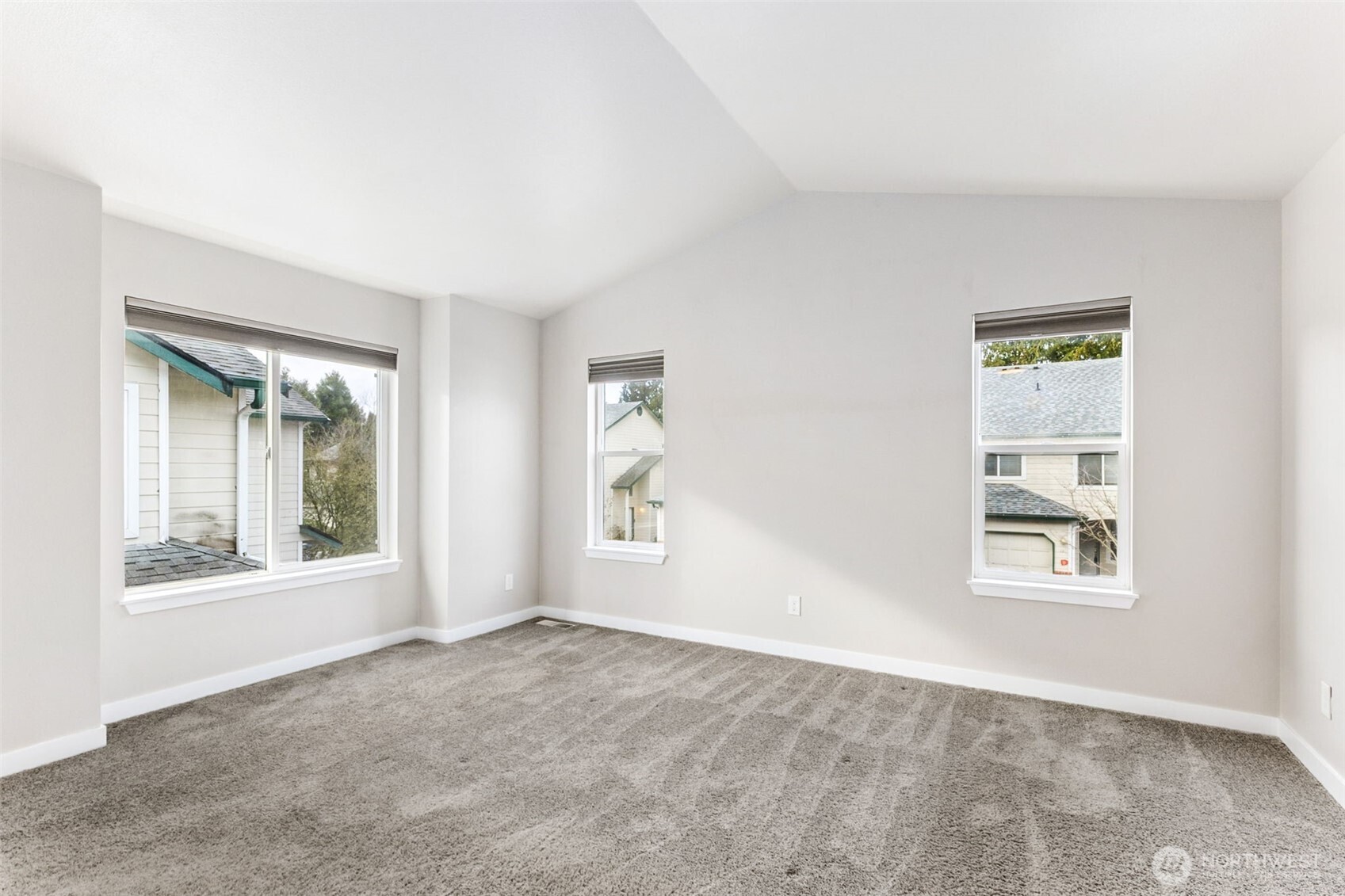 The updated kitchen boasts quartz counters and stainless steel appliances.
