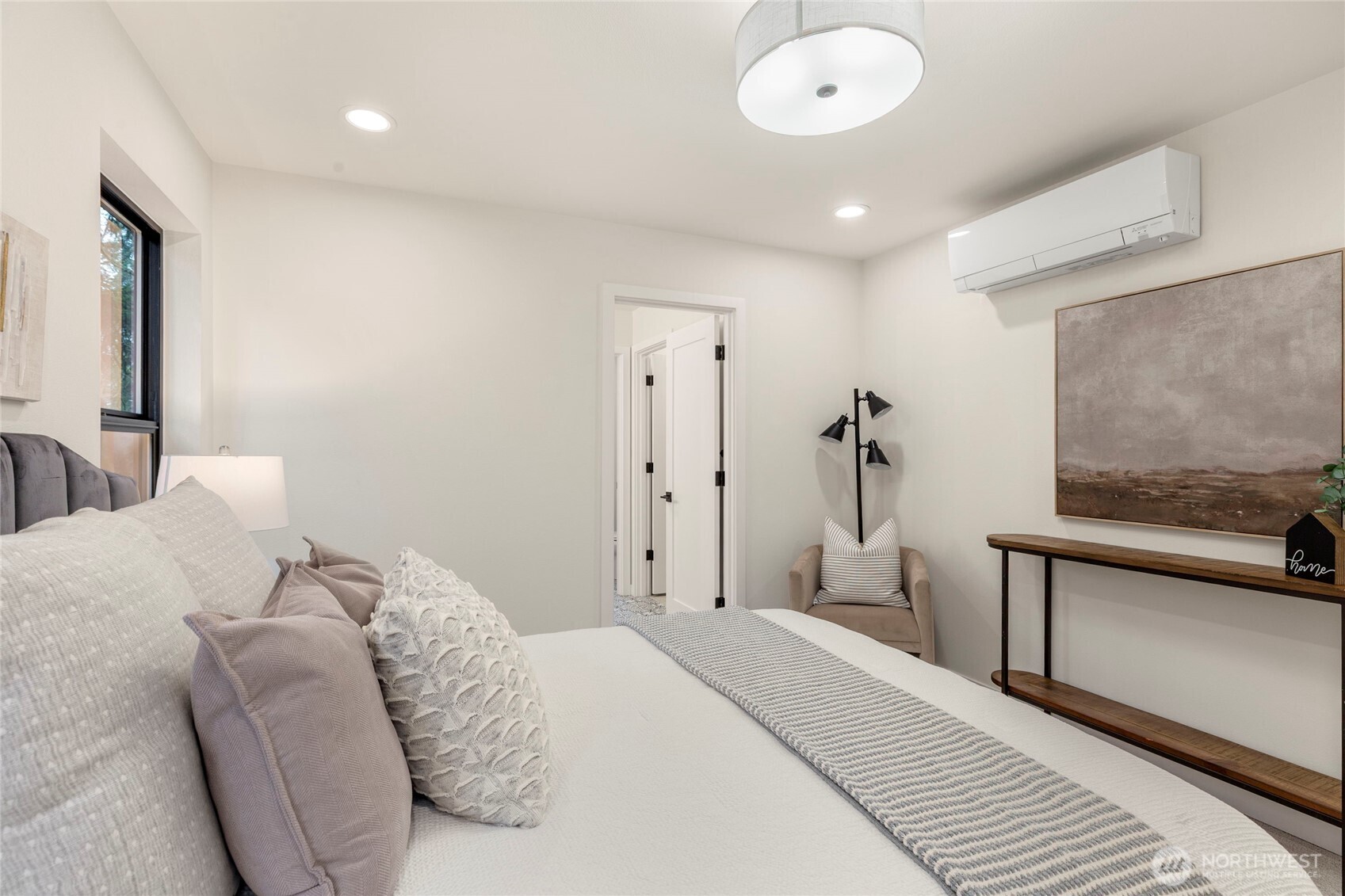 Upstairs primary bedroom connected to full bathroom.