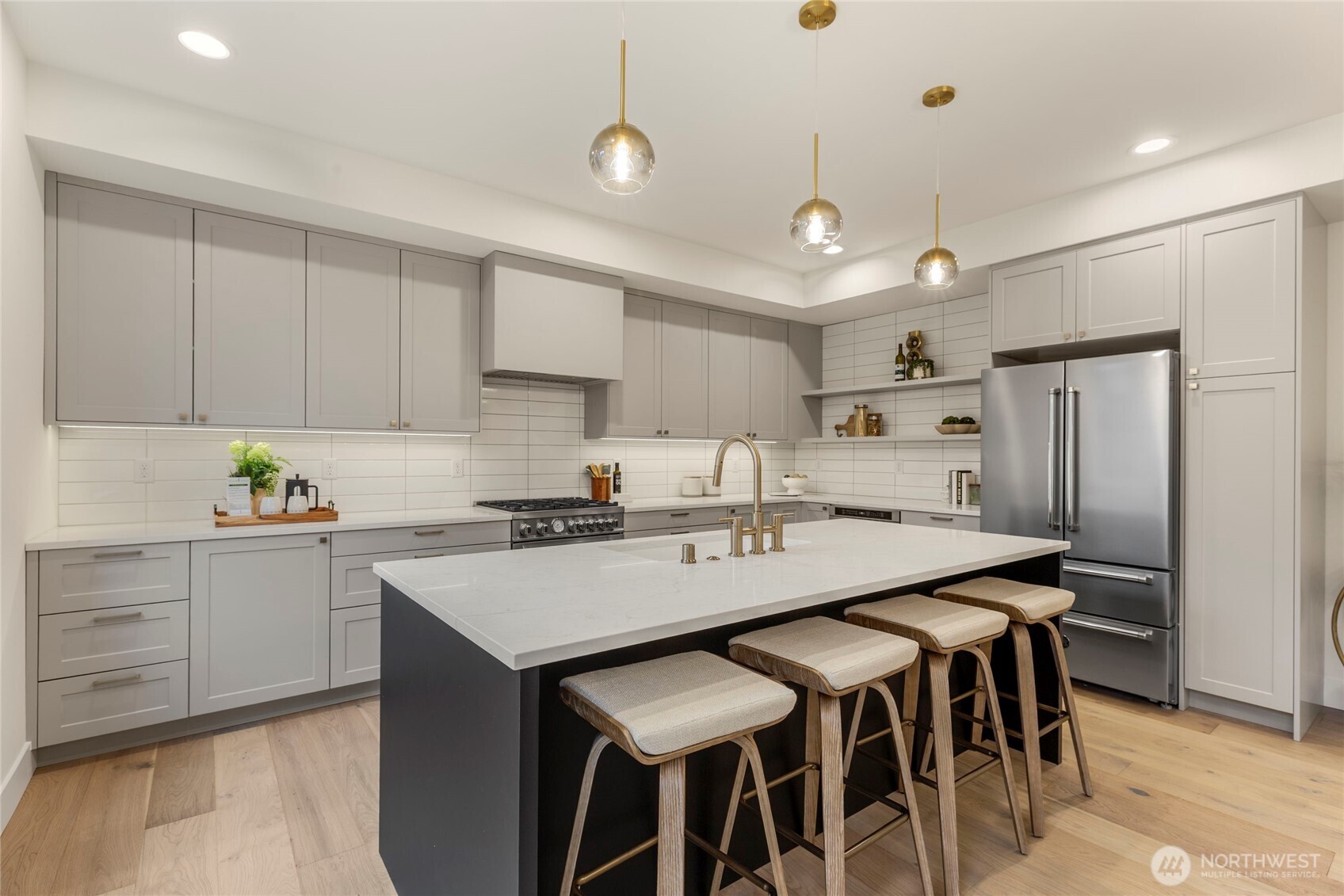 Bertazzoni refrigerator complimented by matte gray kitchen cabinets