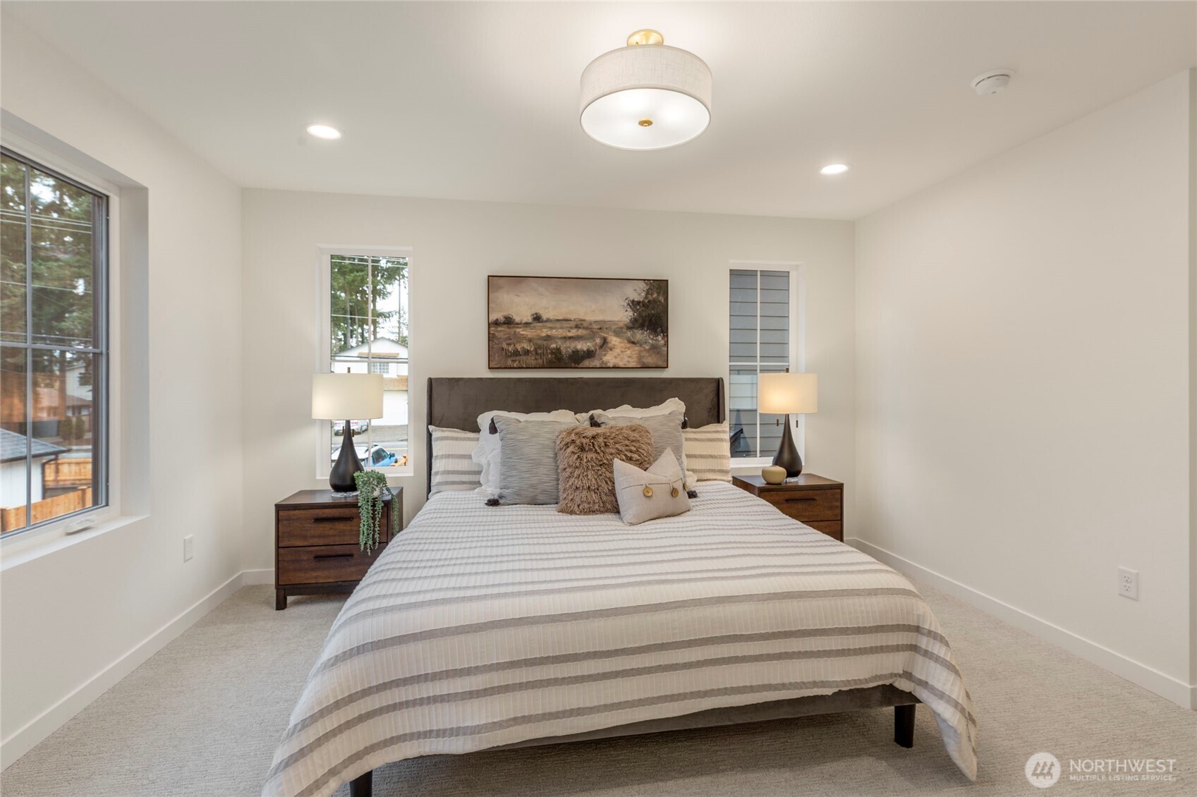 Upstairs primary bedroom offering lots of natural light.