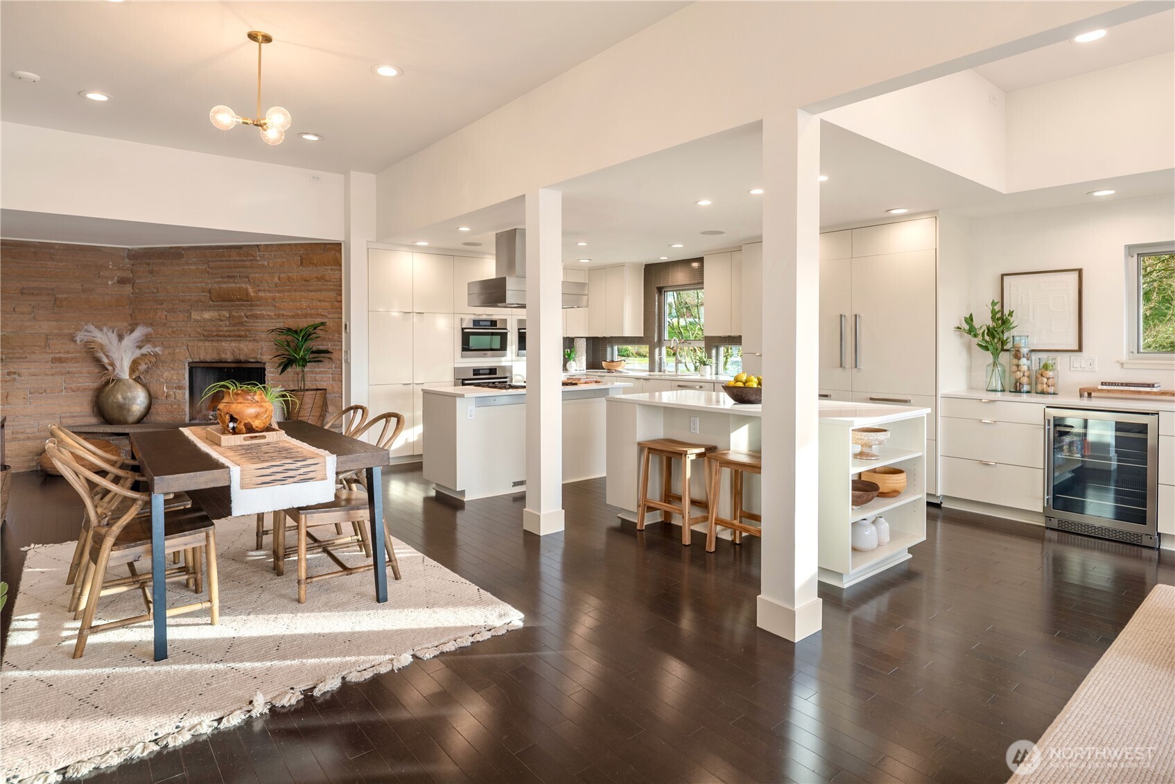 An elegant open-plan main level where form, function, and light converge...with a large dining space, breakfast bar and more.