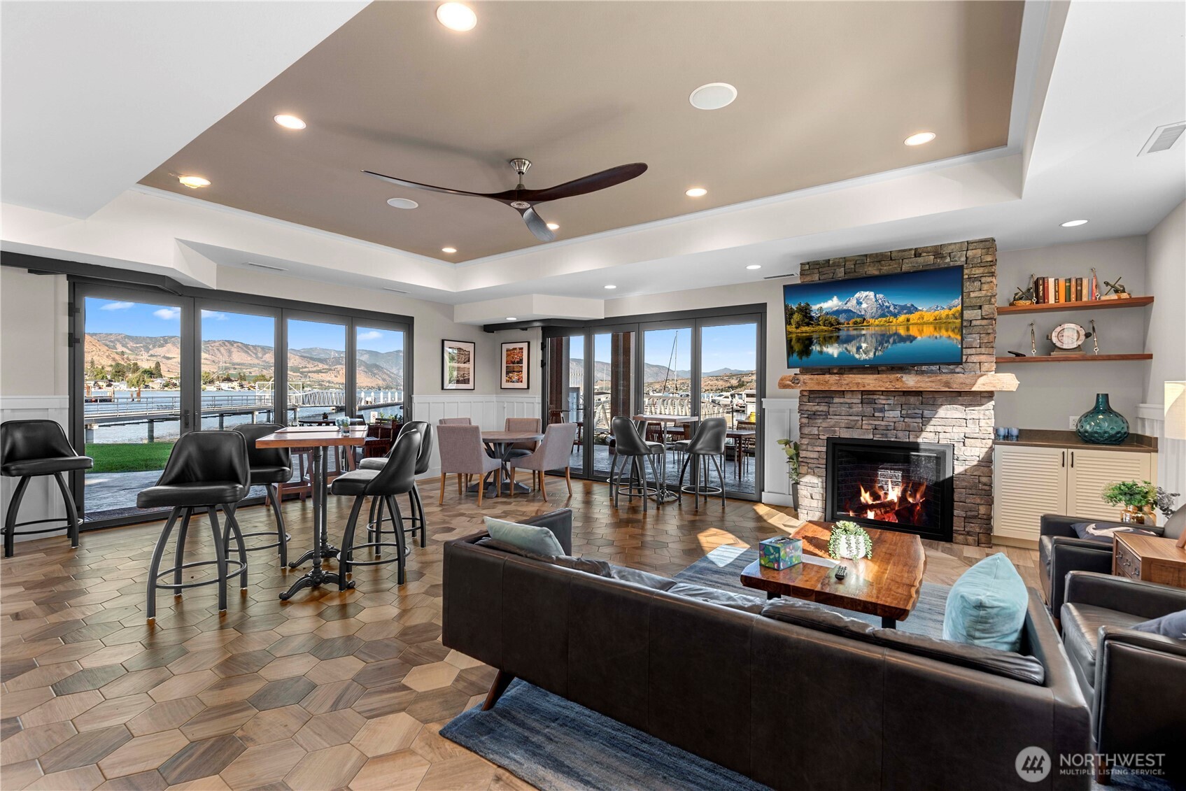 This lounge is so inviting and the big sliders on two sides lead to covered patios.  A fireplace makes watching sports all the more cozy.