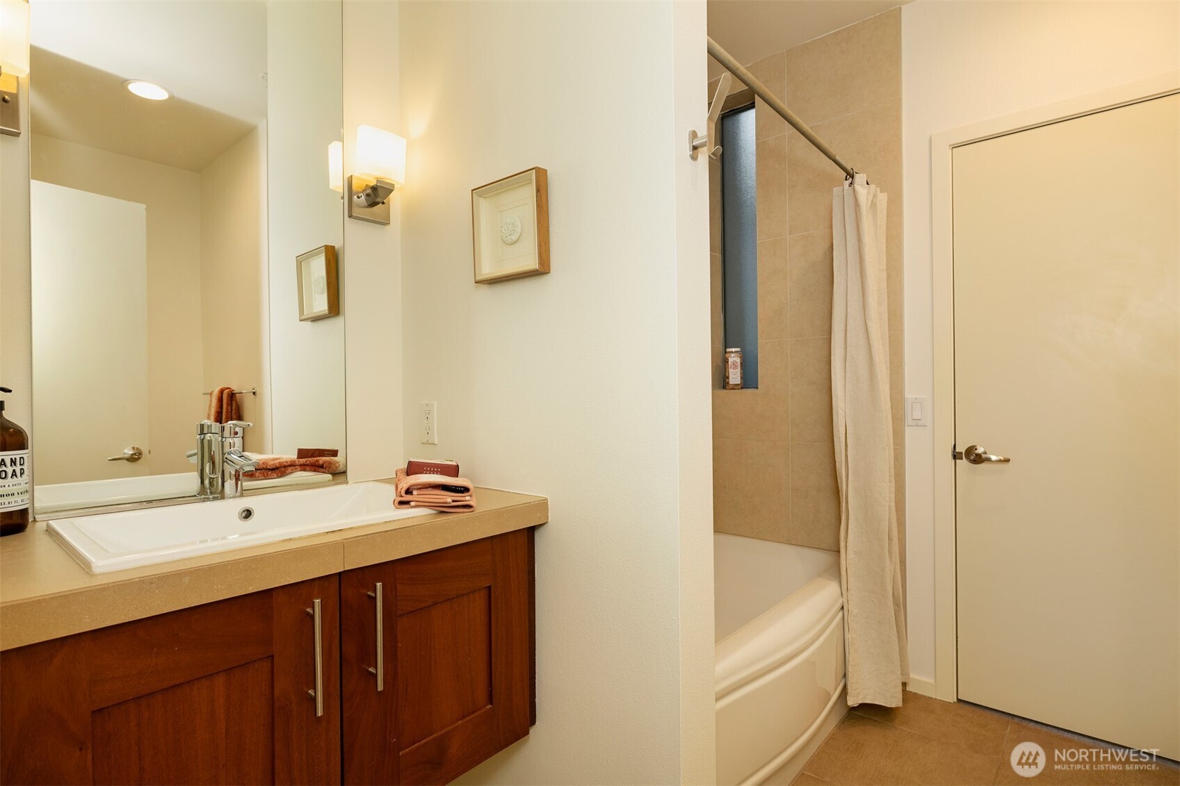 2nd floor full bathroom with ceramic tile flooring & shower surround.