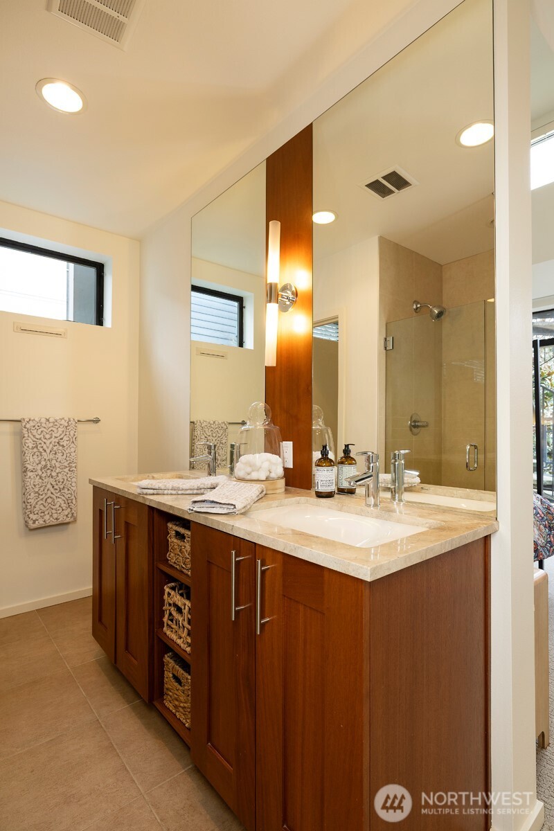 Primary ensuite bathroom with a double sink vanity.
