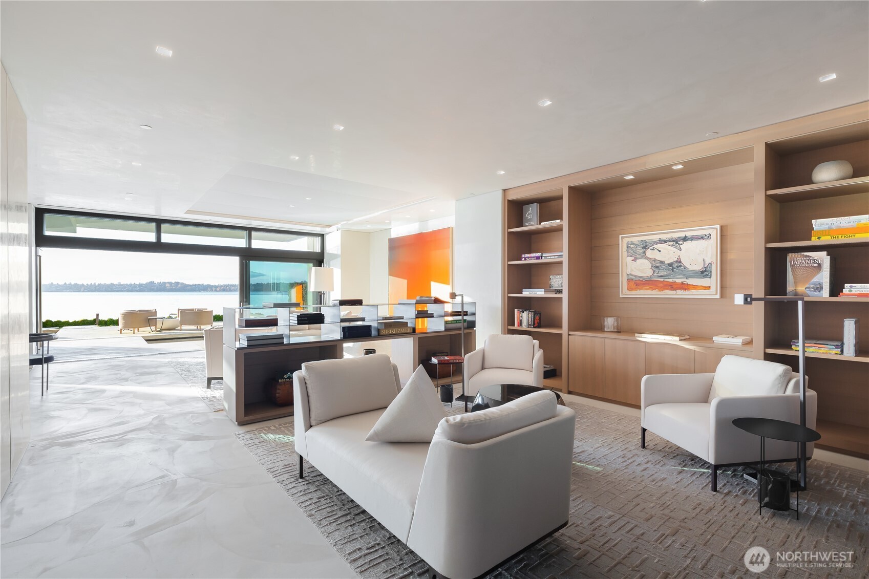 Main living and sitting areas with steel sliding walls that open the entire front of the space to the waterfront.
