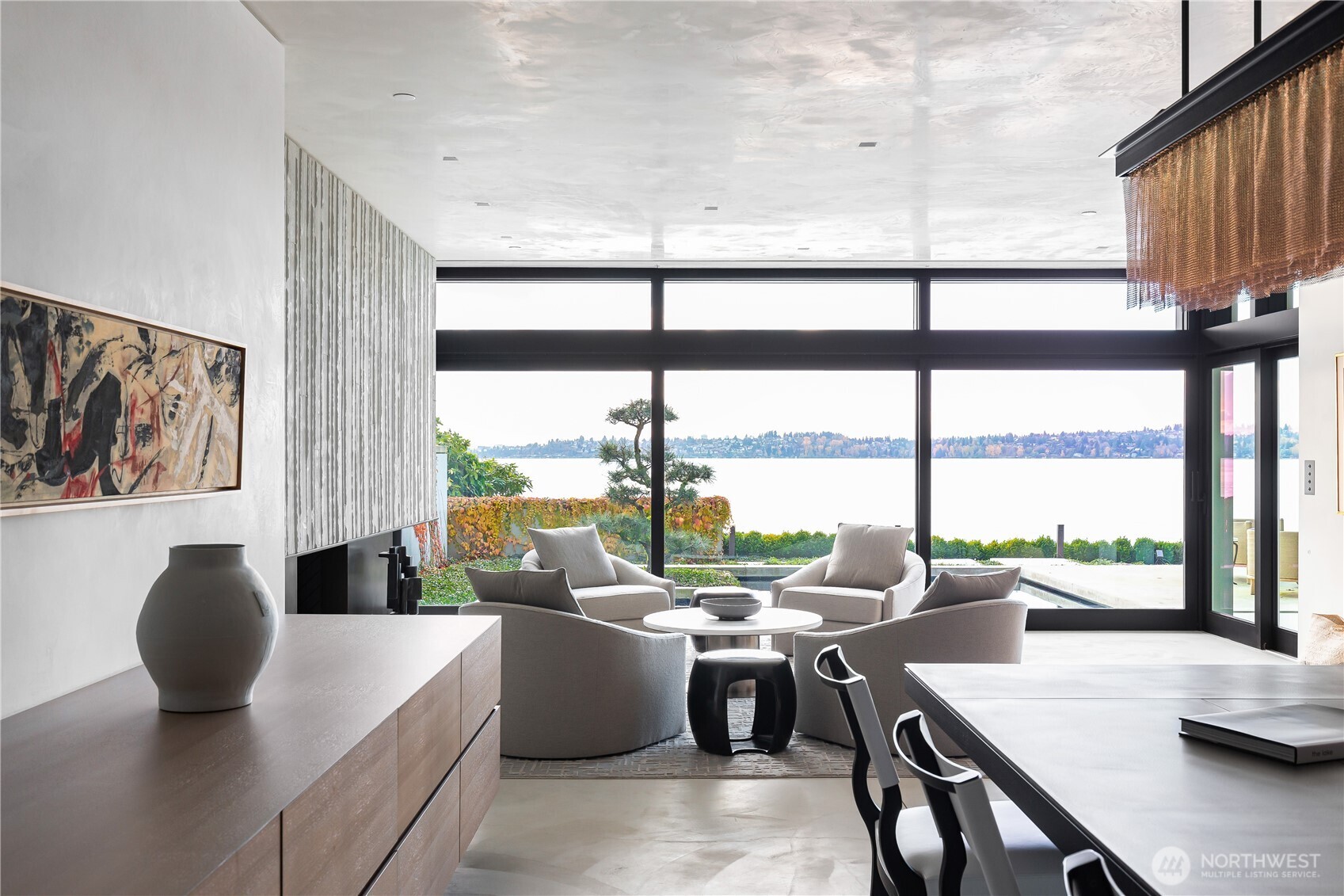 Custom cabinetry completed by local artisans. Solid nickel dining room table with seating for twelve.