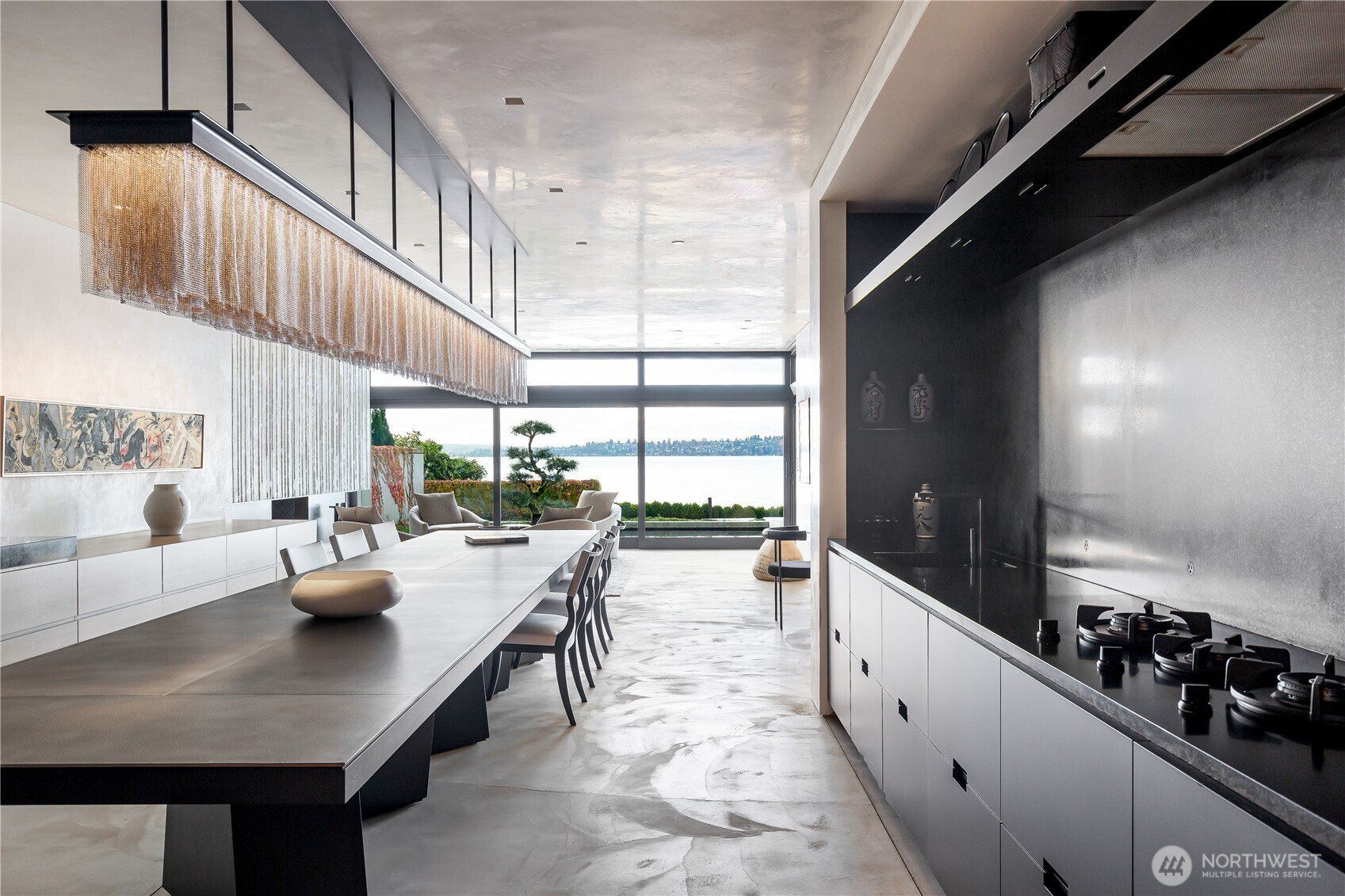 Center Island dinning table and prep space, Gagganeu cook top, Miele and Liebherr appliances.