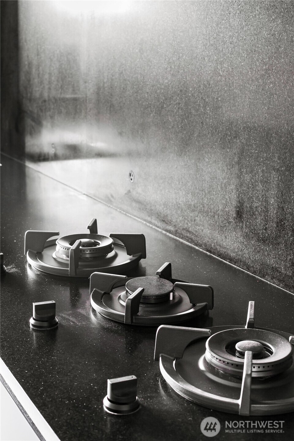 Honed stone counters and backsplash.