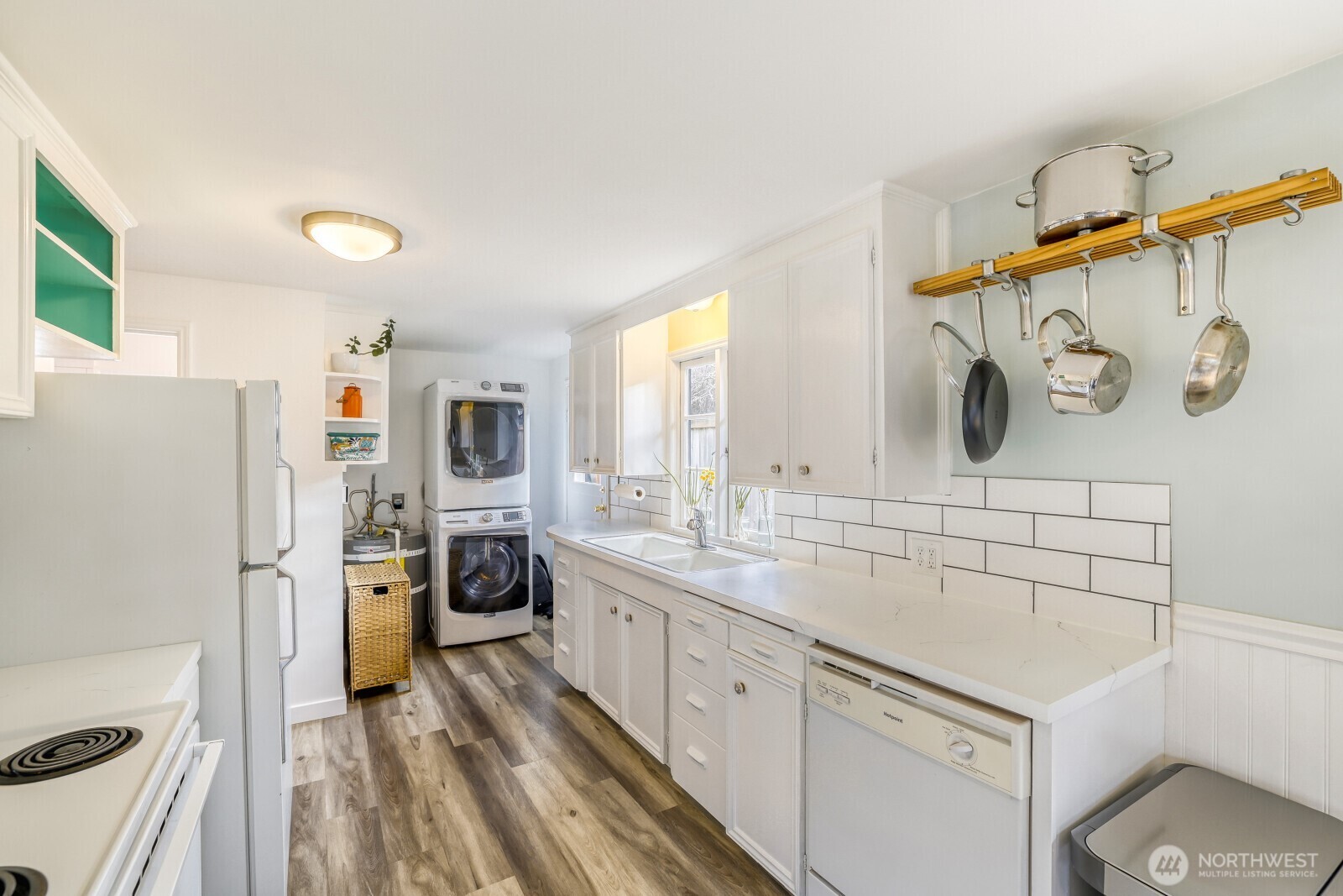 Big window in kitchen bringing in more light.