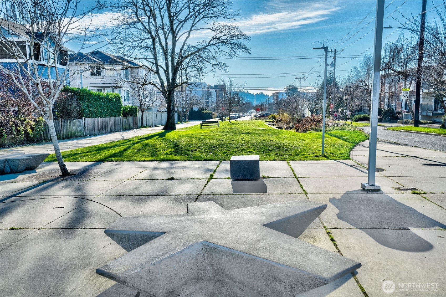 A lovely neighborhood "park" on 14th keeps traffic to a minimum and tranquility to a maximum.