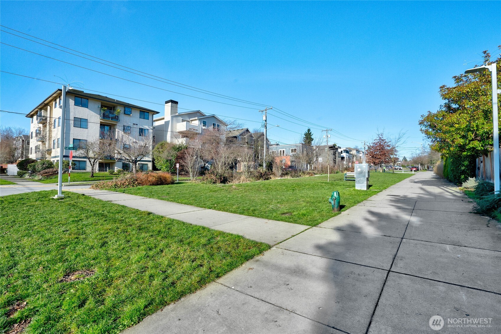So much green space and abundant daylight on 14th! Welcome to your new Ballard home.