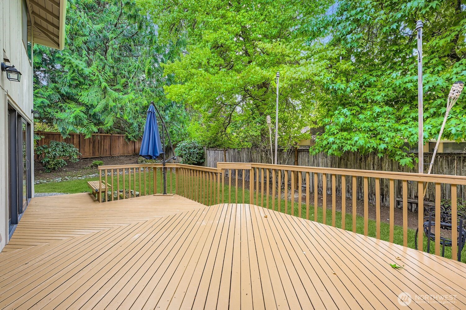 A brand new fence has been recently installed. The two-level spacious deck will make entertaining enjoyable with wonderful privacy created from the mature landscaping and trees.