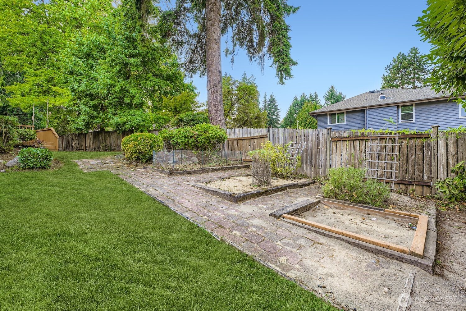 Enjoy gardening and harvesting your bounty in these raised garden beds during the summer. A new fence and has been installed since this photo was taken.