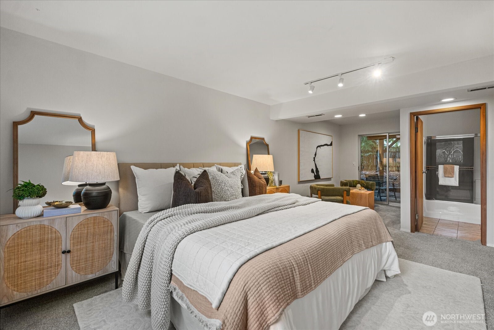 Spacious hall bathroom featuring a tub and oversized vanity, ideal for household use.