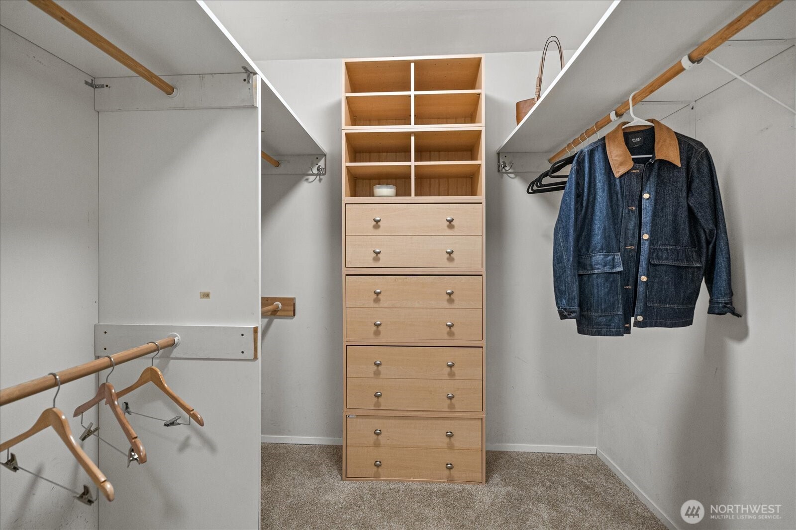 Off of the fourth bedroom/family room is a large walk-in closet with a spacious dressing or exercise area, adding versatile functionality to this space.