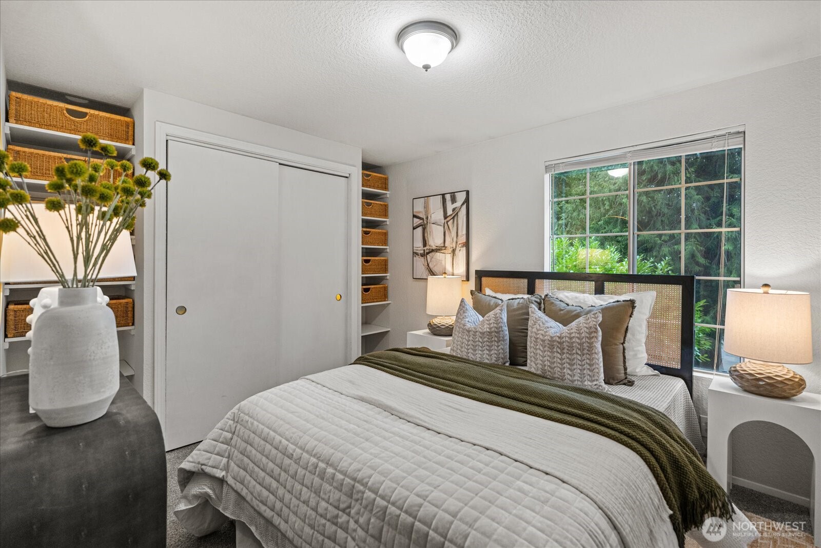 Updated kitchen featuring all-new stainless steel appliances and new lighting.