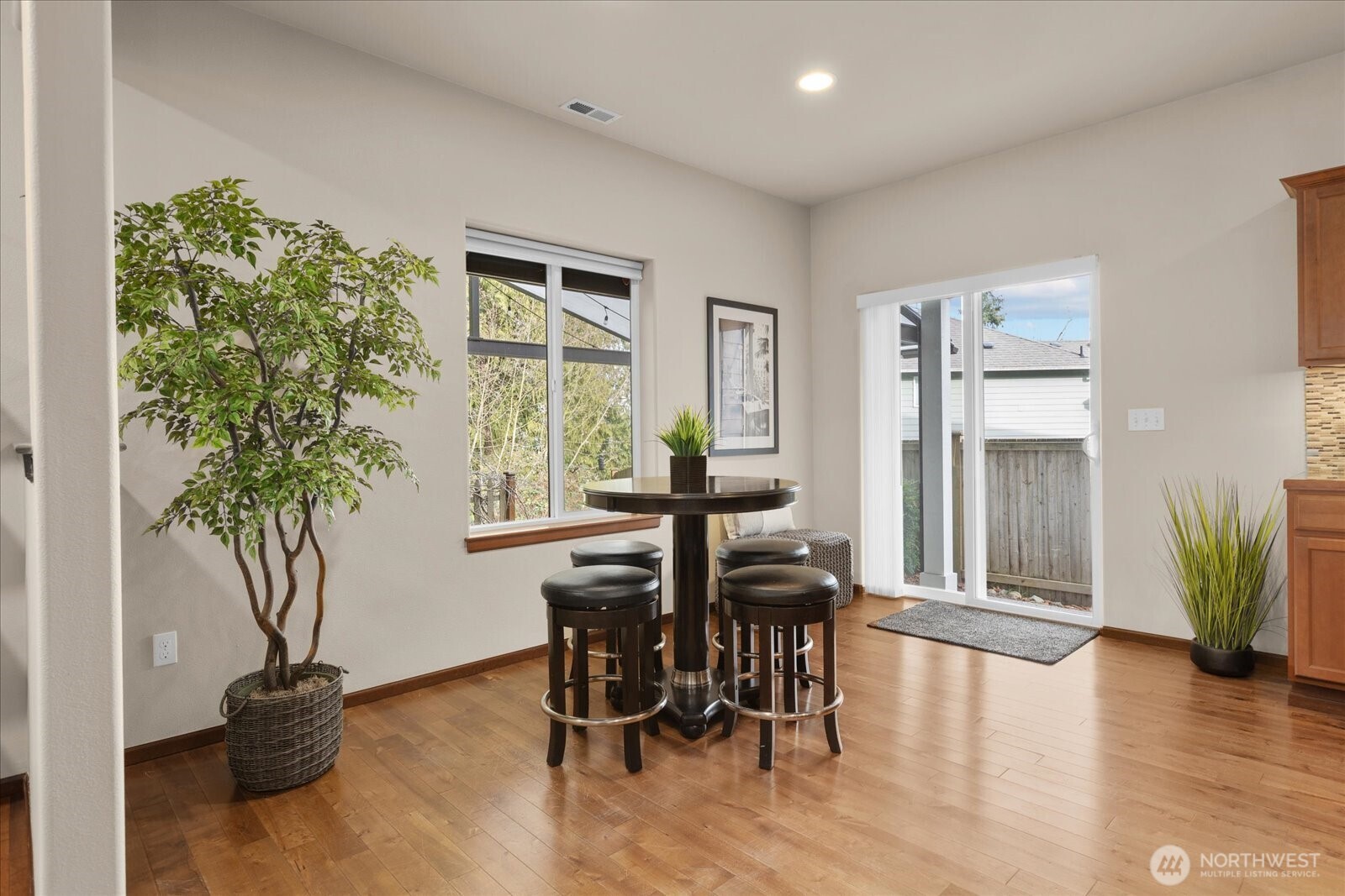 Huge nook area w/slider leading out to backyard oasis.