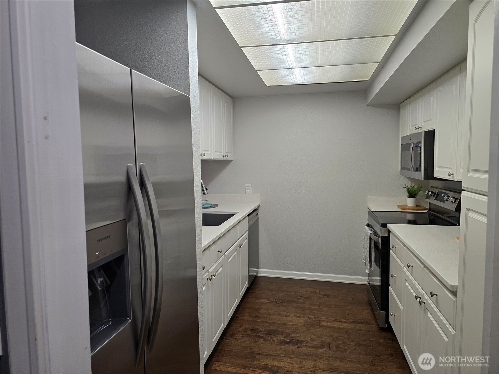 Entry to large kitchen with gorgeous counter tops