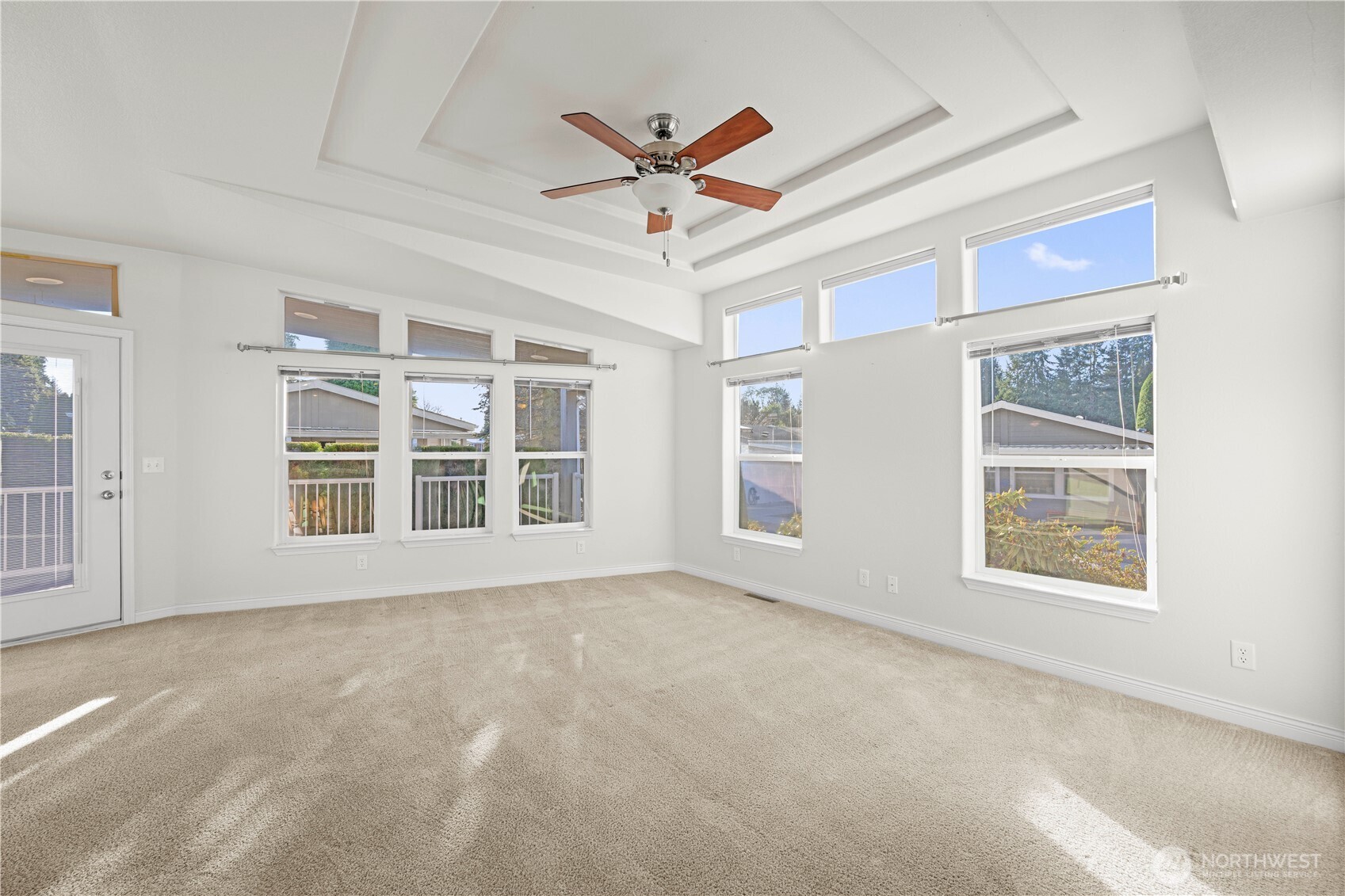 Enjoy an airy, open feel with large windows that fill the home with natural light and offer serene views of the blue sky.