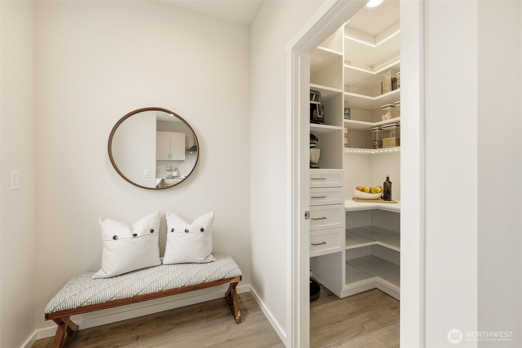 Walk-in closet with custom organization for effortless storage.
