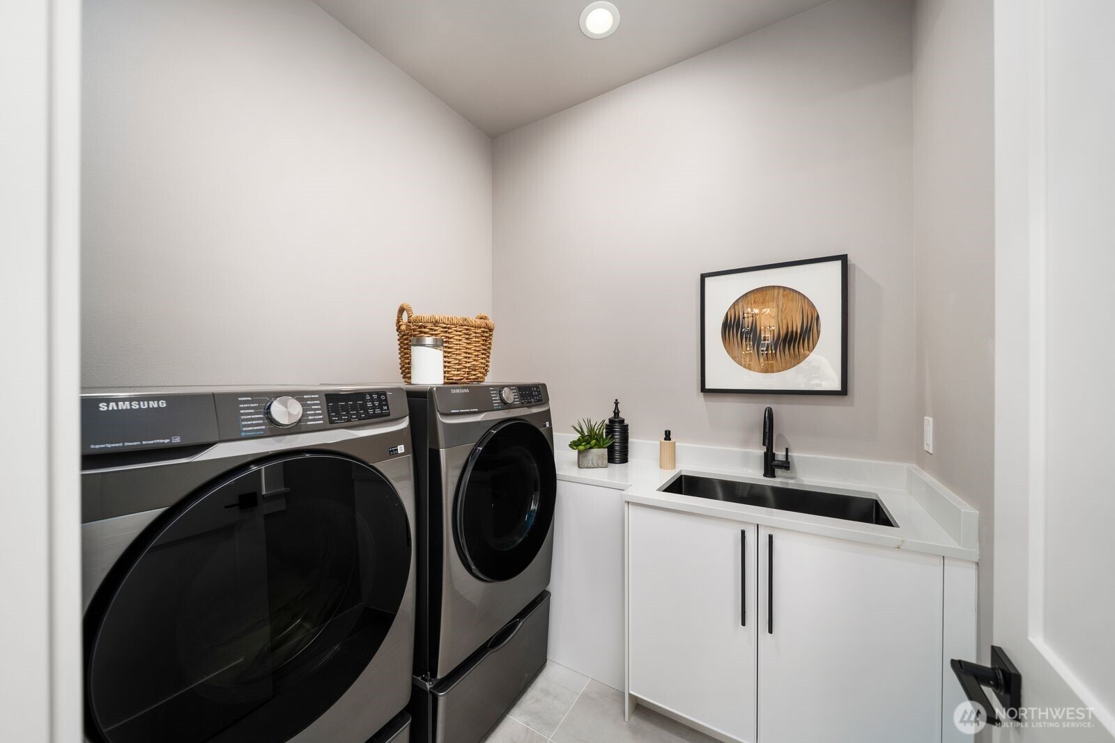Laundry room with utility sink.