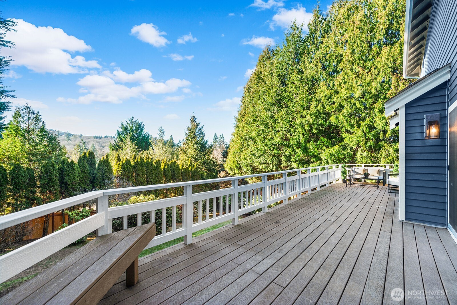 Huge deck off the kitchen area, stairs to the back yard