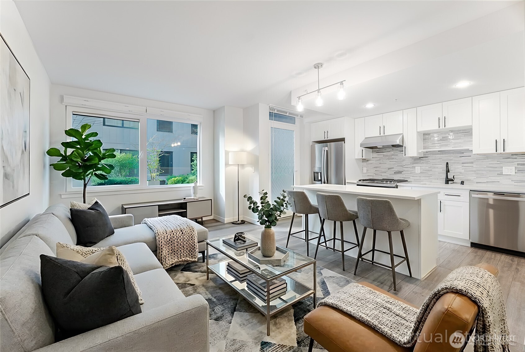 This beautifully presented property features a spacious and inviting living room, complemented by a modern and updated kitchen. (virtually staged).
