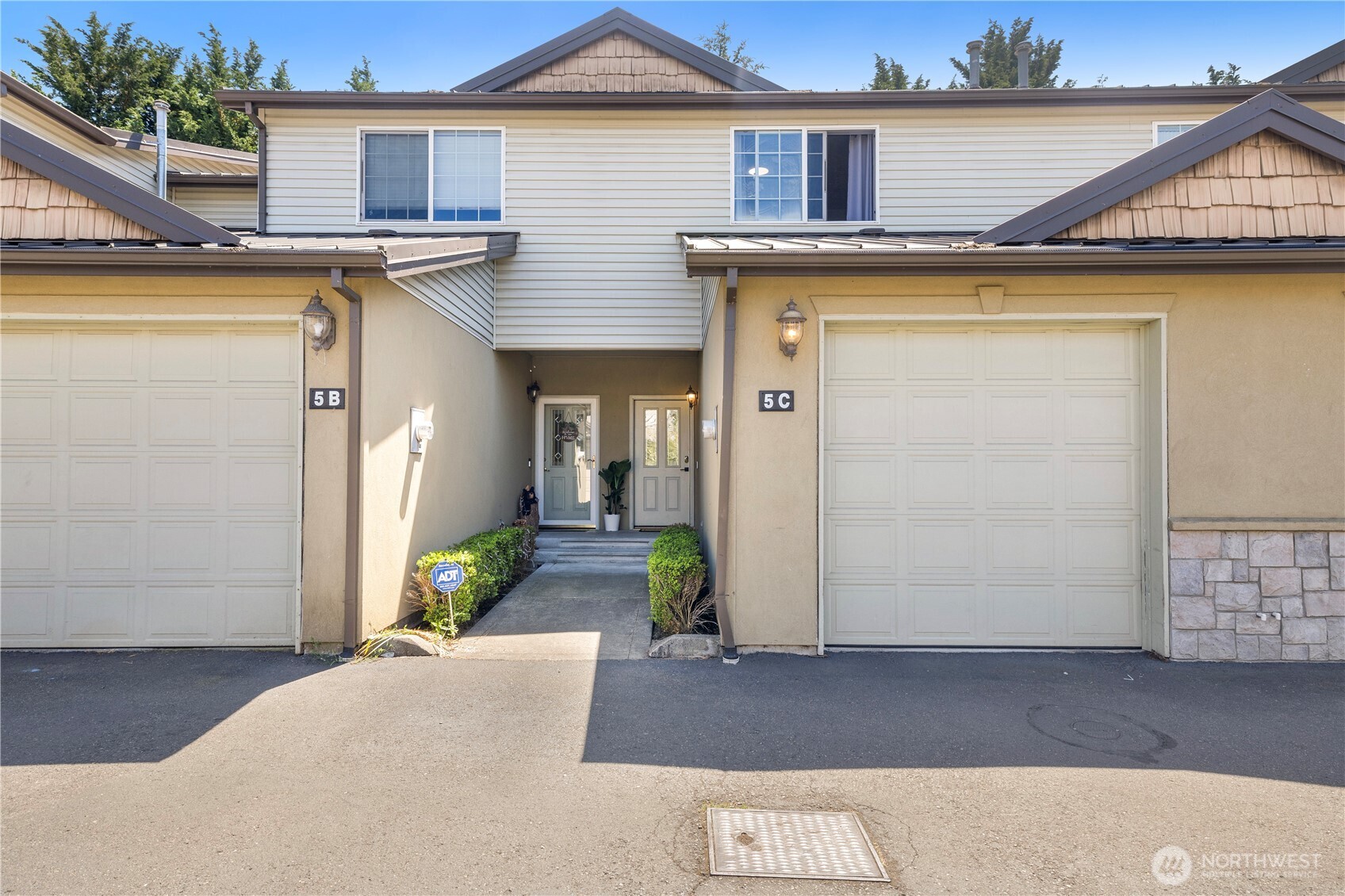 Unit 5C on the right side. The garage leads into  the home from the inside.
