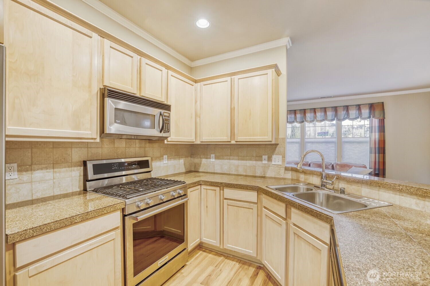 Meticulously maintained kitchen with ample storage and counter space.