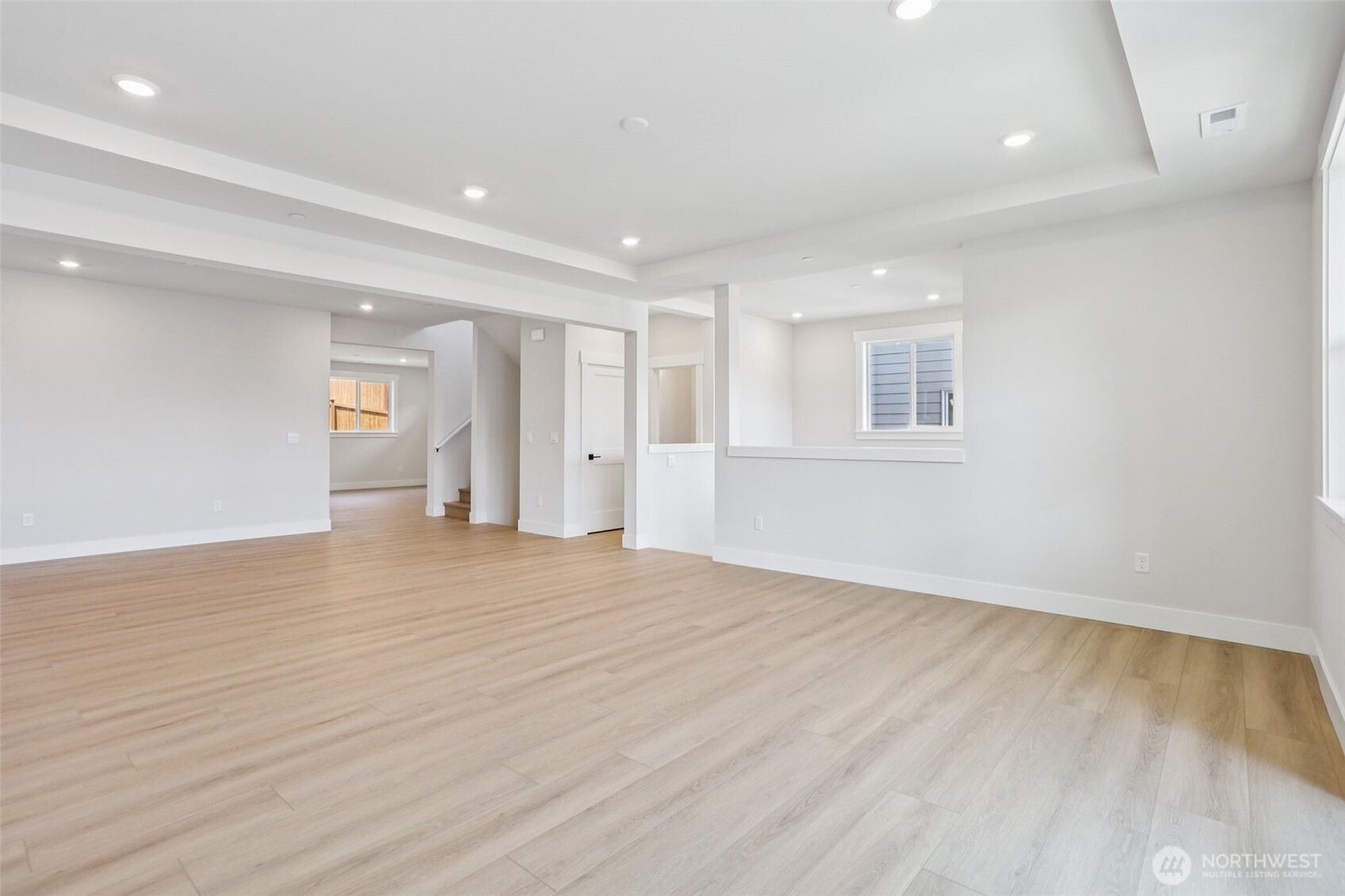 View from great room into dining room and kitchen.