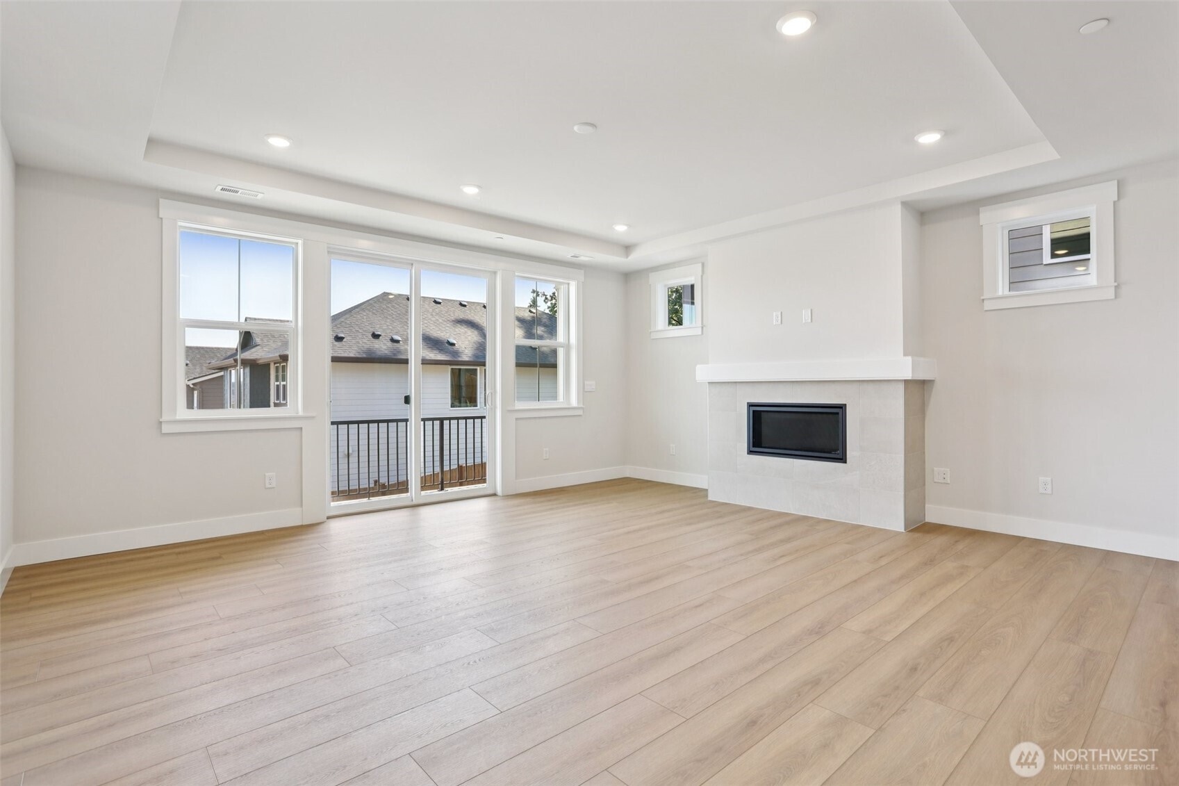 Light filled great room opens to covered deck for easy entertaining.