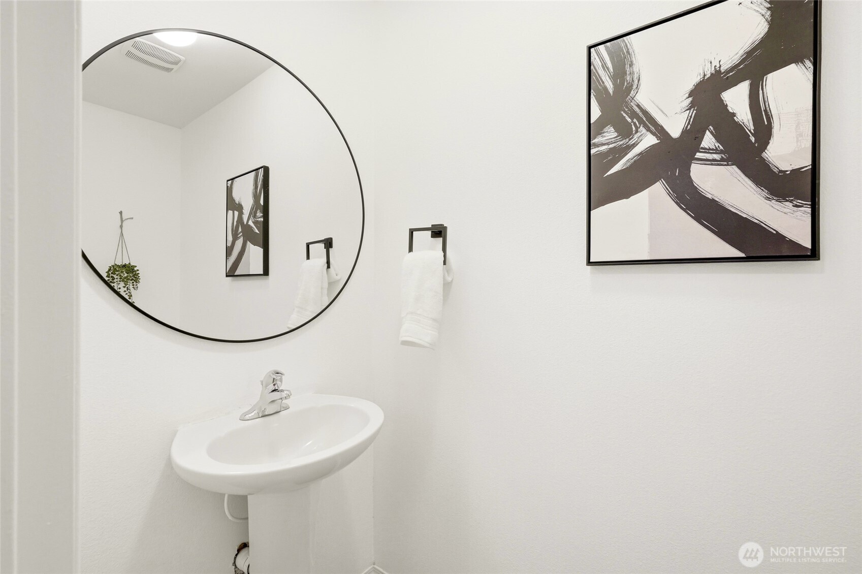 Spacious main-level half bath for guests and everyday convenience