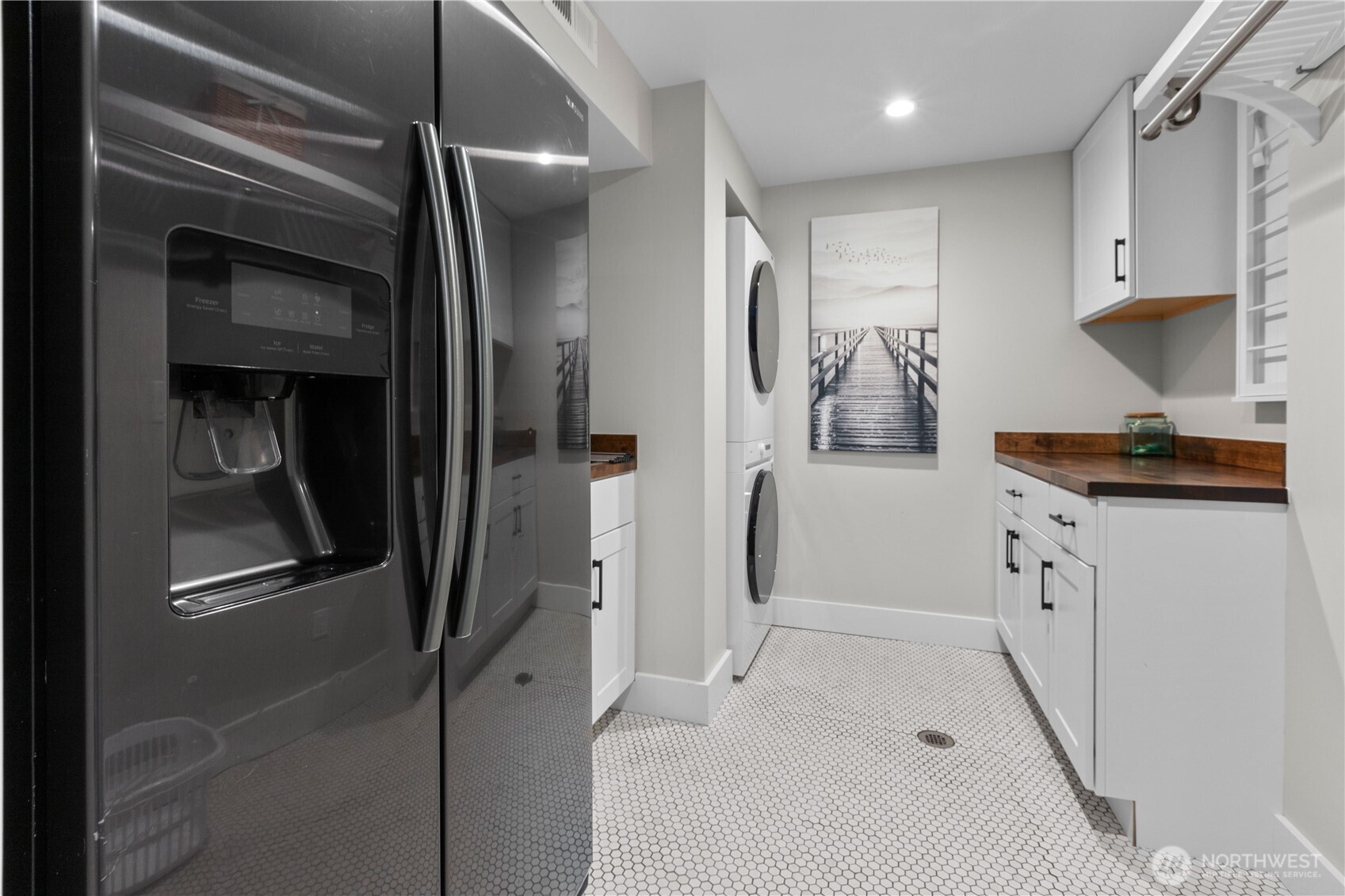 Downstairs laundry and second refrigerator