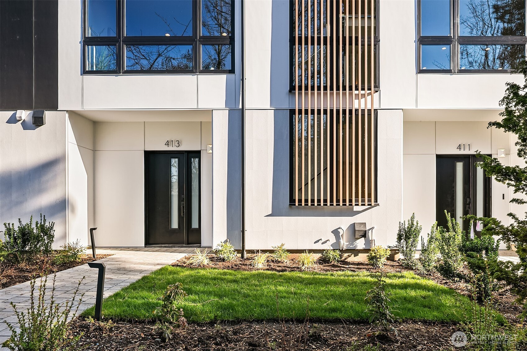 Private street runs along west side of site with guest entrance to 413