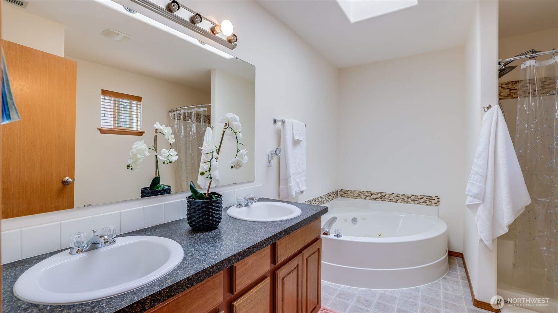 Double vanity sink provides ample space for two, offering convenience and style for busy mornings