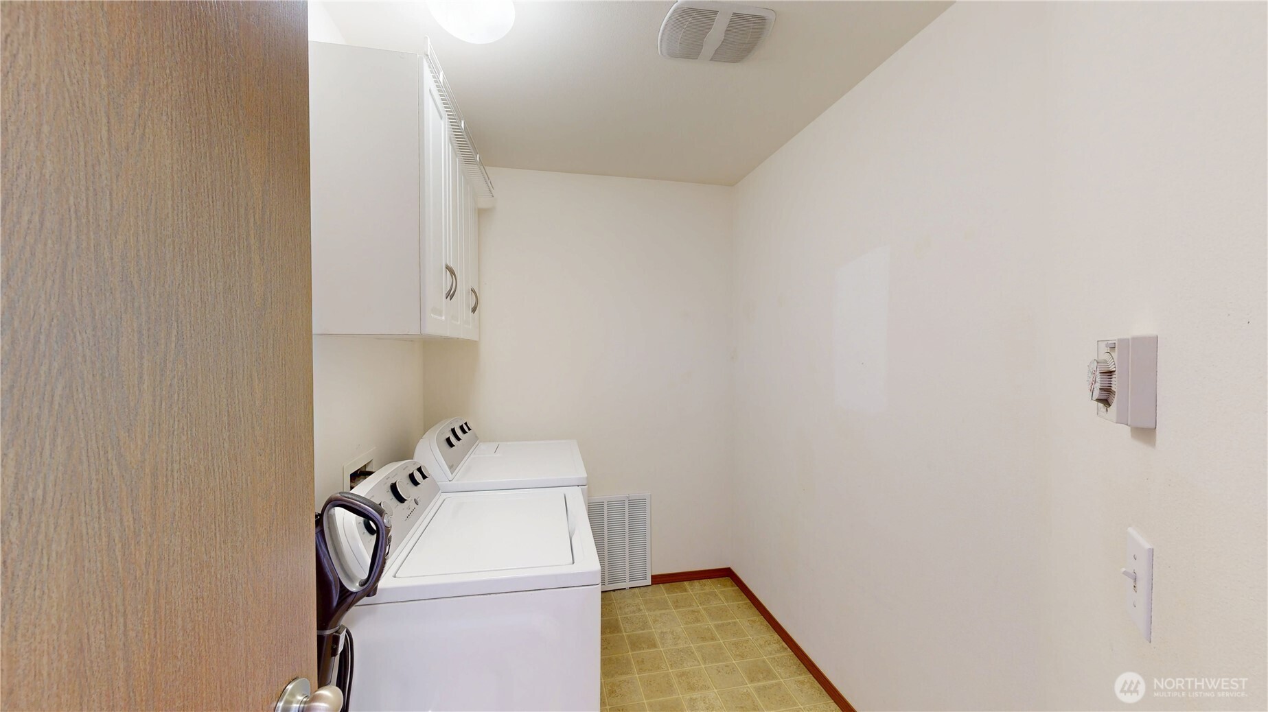 Convenient and spacious upstairs laundry room.
