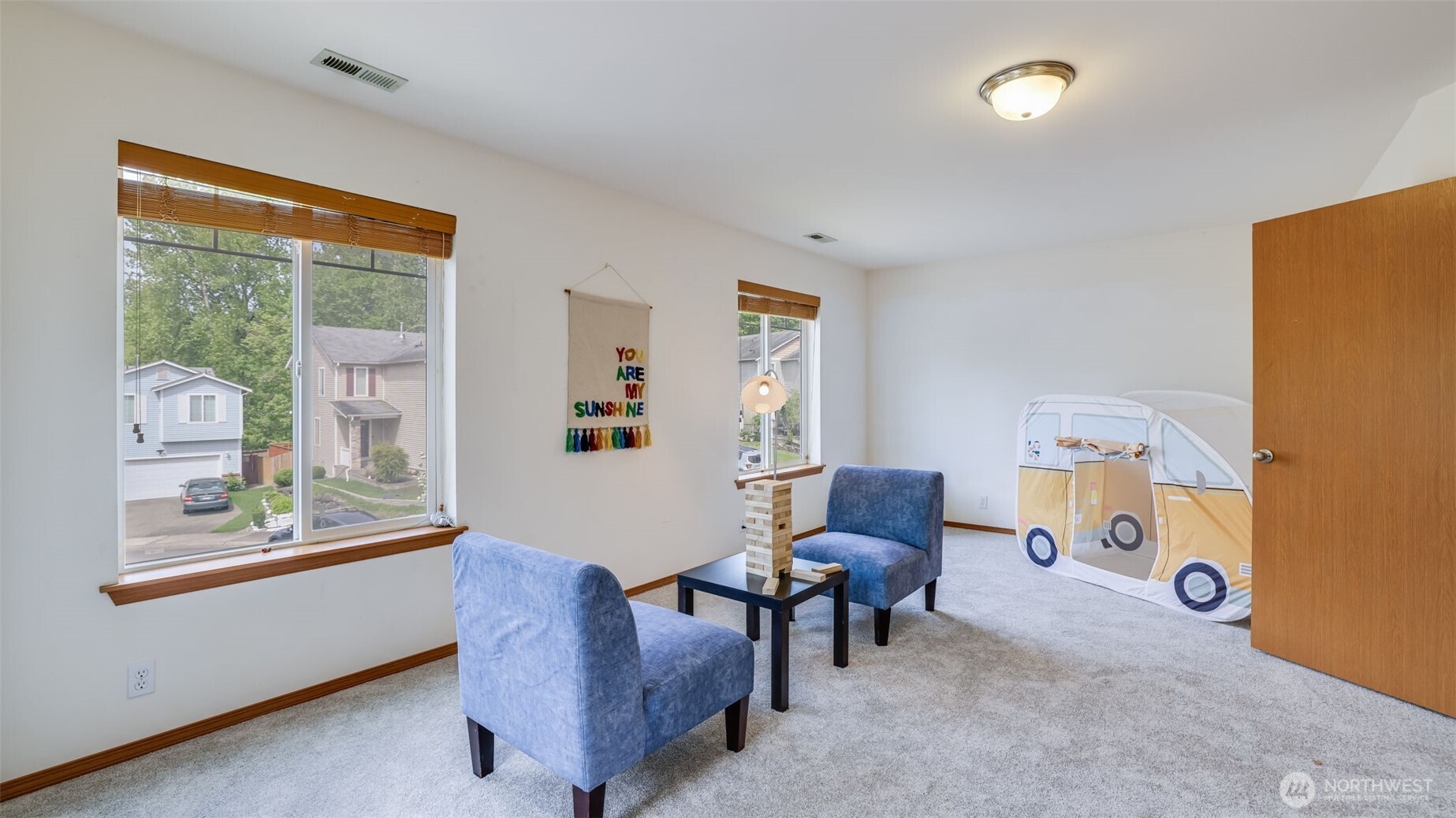 Generous natural light fills this spacious fourth bedroom, creating a serene environment that's perfect for unwinding and recharging