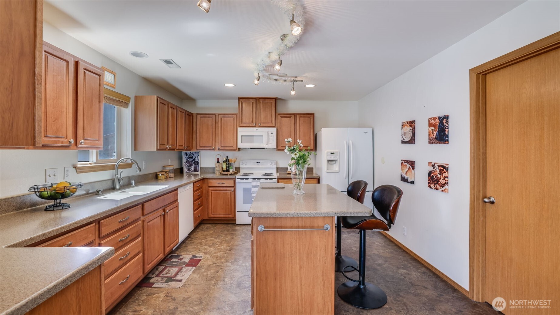 This oversized walk-in pantry offers generous storage and easy access to all your kitchen essentials