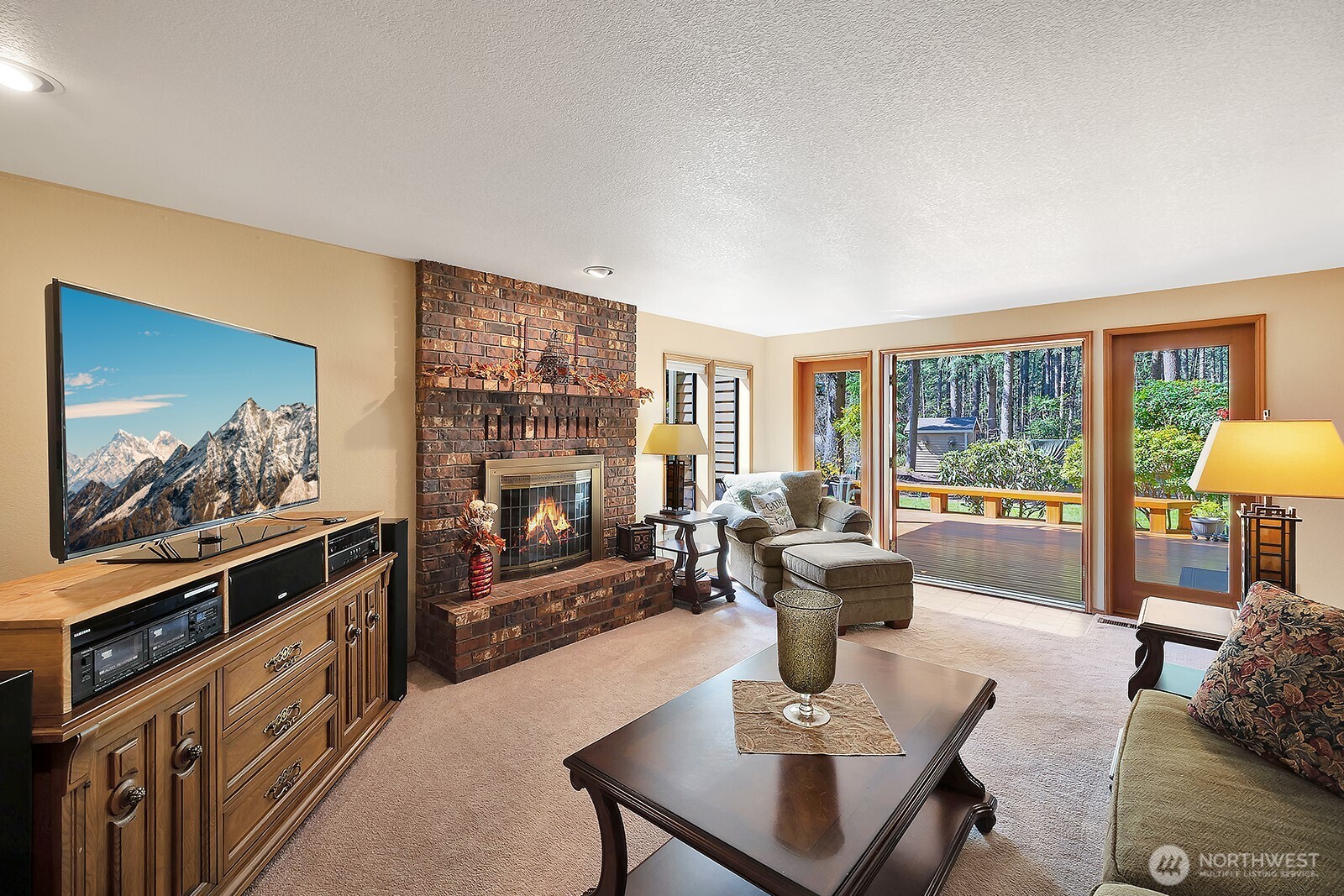 Great room with French doors, lead out onto covered deck so you can enjoy the beauty of your peace of quiet