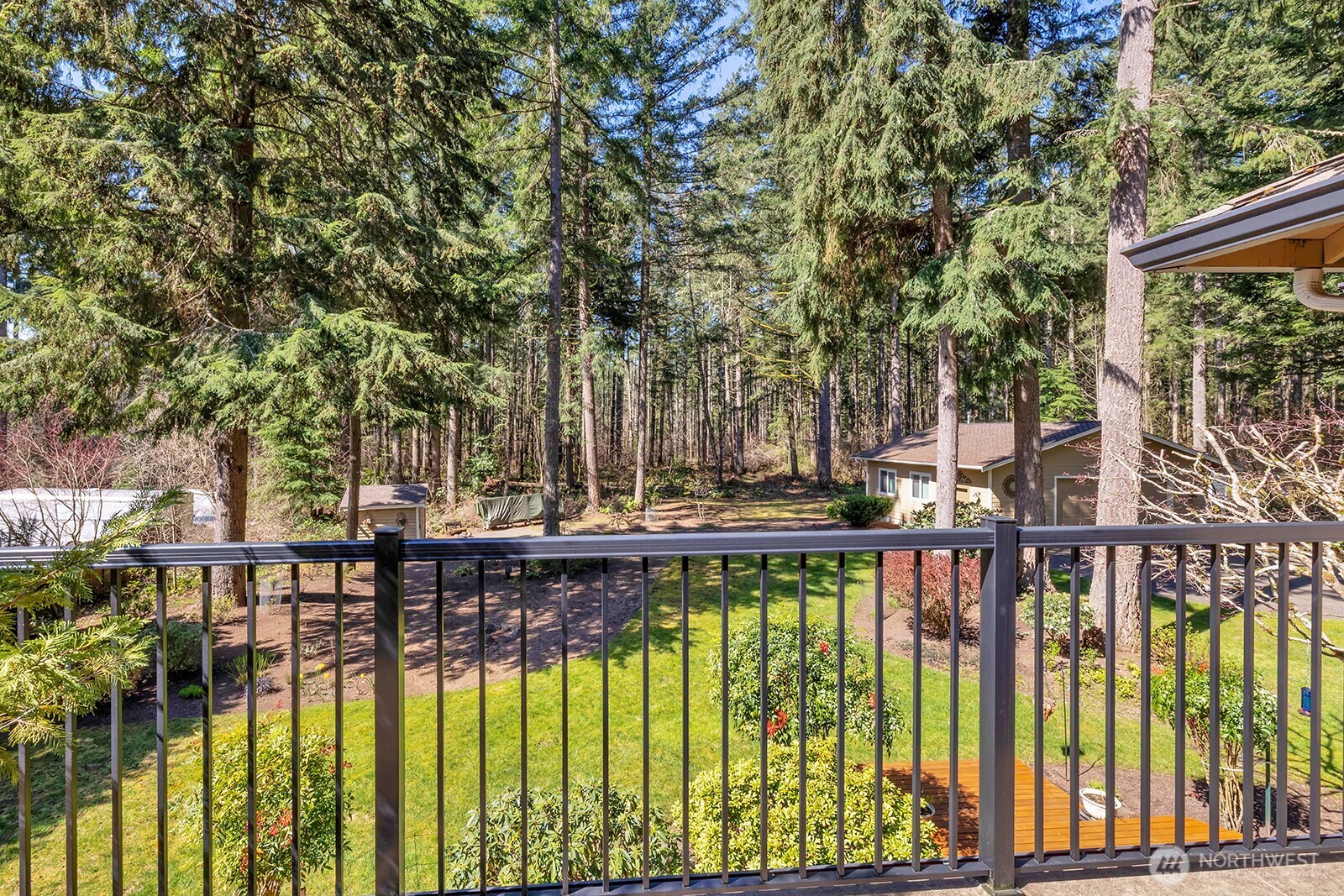 View from Primary bedroom deck. Overlooks peaceful and quiet greenbelt where birds and wildlife abound.