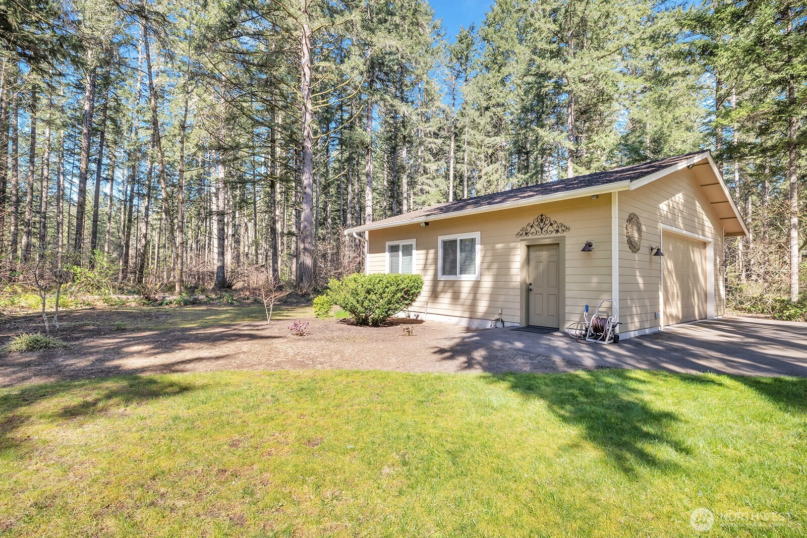Detached garage (30X30) 900 SF, insulated and heated, 220v service.