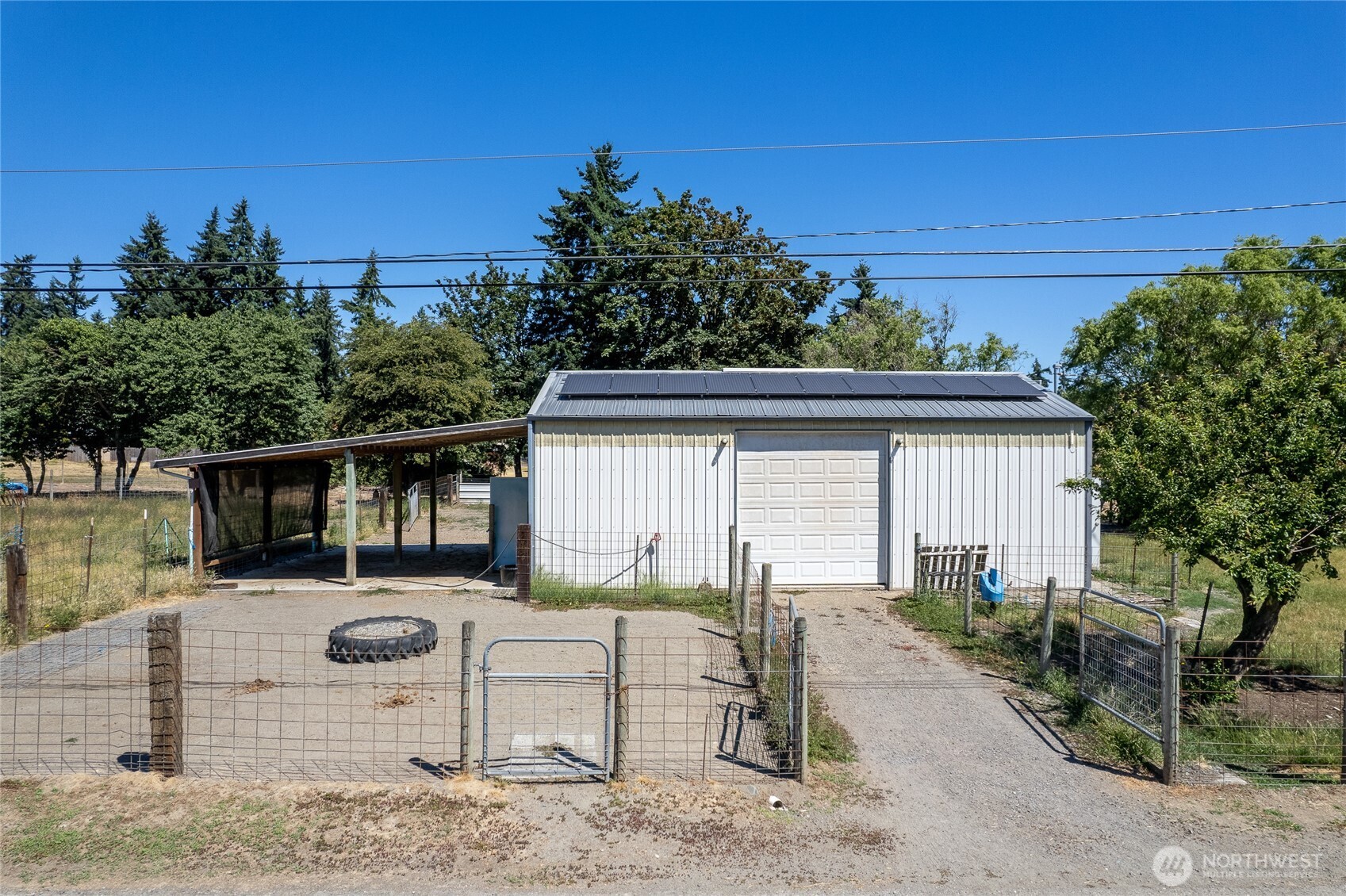 Barn- This structure is served by 200-amp electrical service and includes ten solar panels to support efficiency. LED lighting and partial insulation enhance functionality, while a small storage loft and attached awning add versatility.