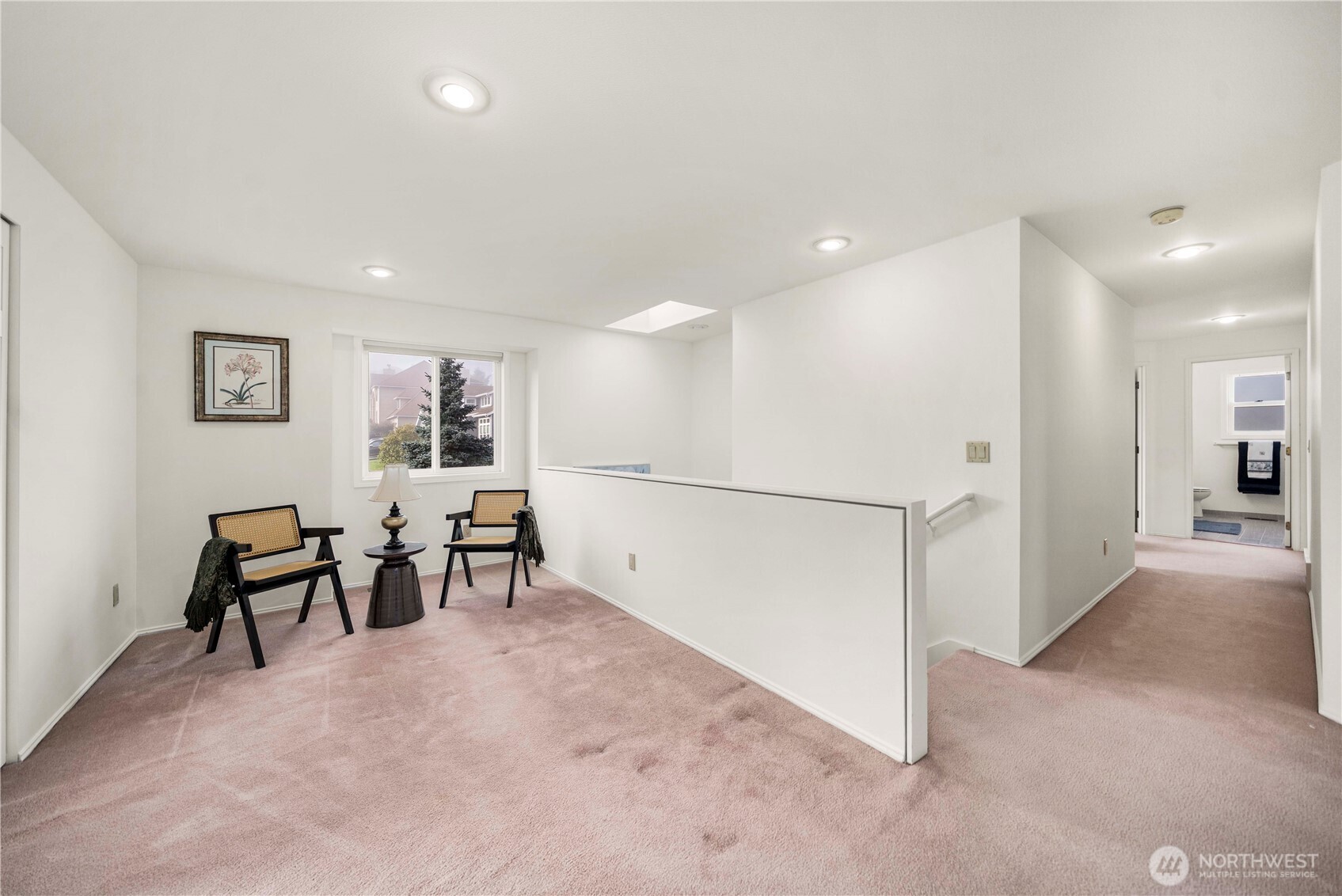 Once upstairs, you land here! This area is so versatile; what will you use it for?  The Bonus Room, the Primary Bedroom and 1 other bedroom are on this end. Then down that hallway is another bathroom and 2 more bedrooms. The layout is Amazing and so functional.