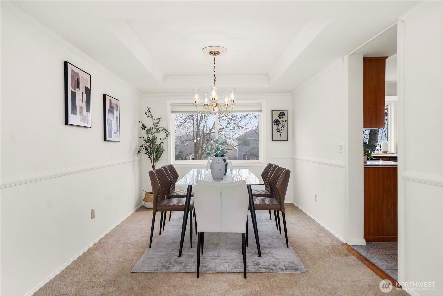 The Formal Dining Room with a Coved Ceiling and Crown Molding. Also, HoneyComb Cellular Blinds throughout.